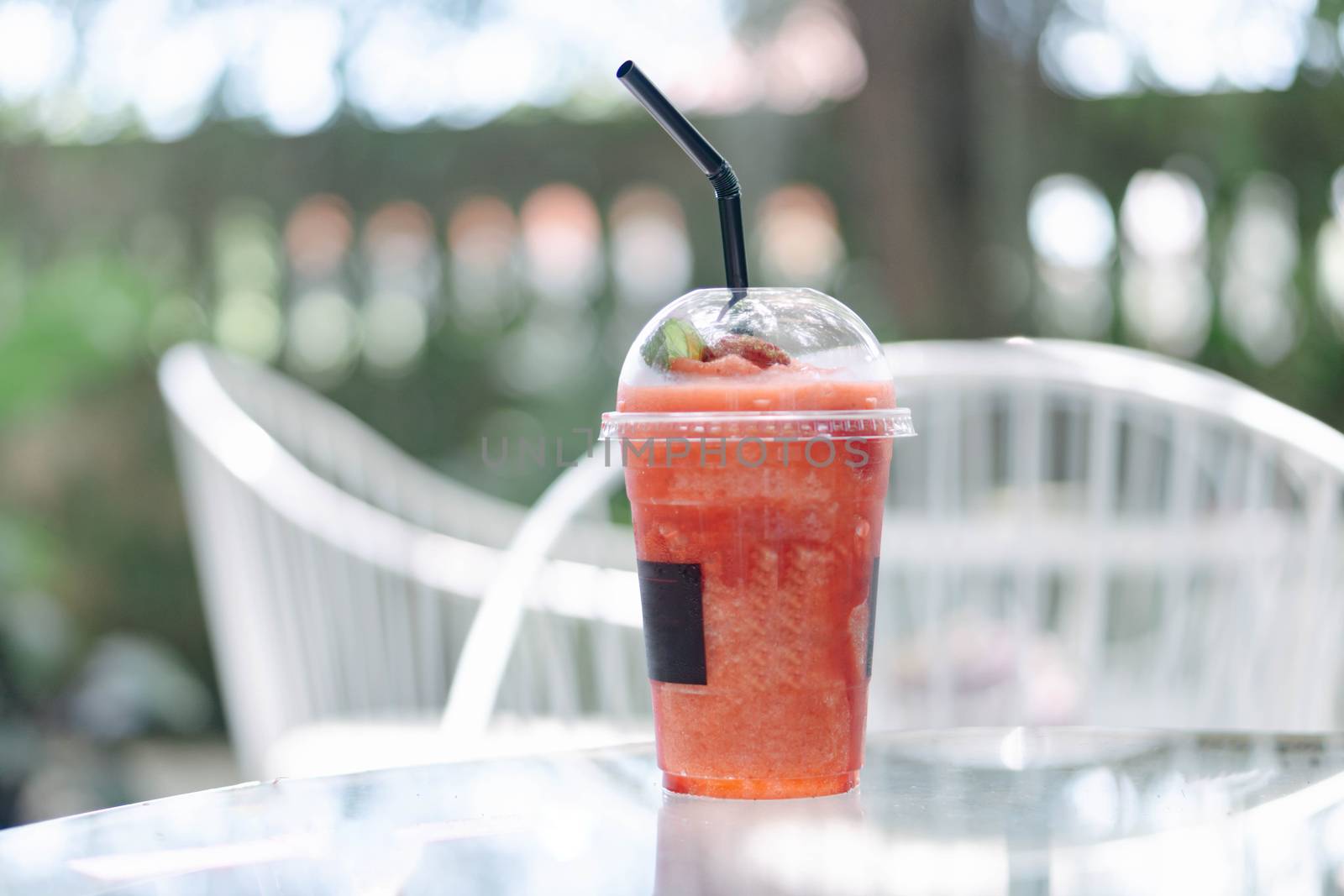 Closeup watermelon smoothie on wood table, selective focus by pt.pongsak@gmail.com