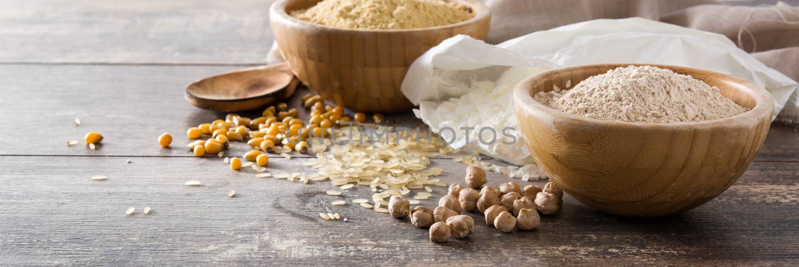 Different organic flour on wooden table. Copyspace by chandlervid85