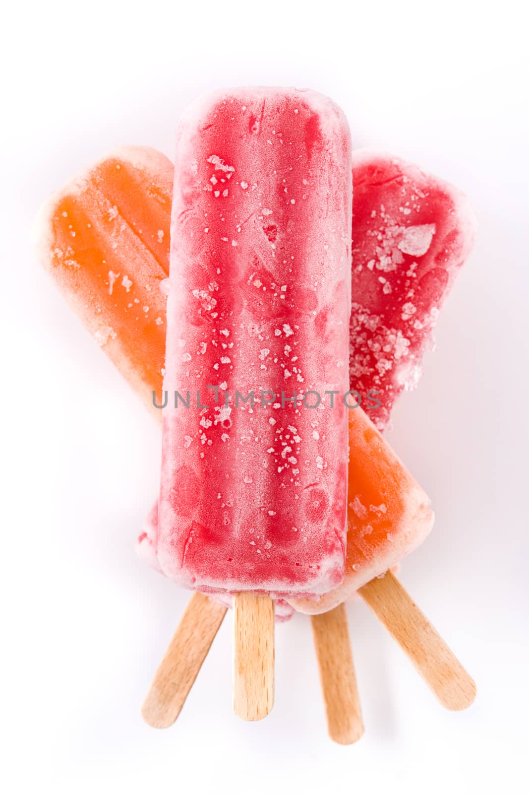 Orange and strawberry popsicles isolated on white background.