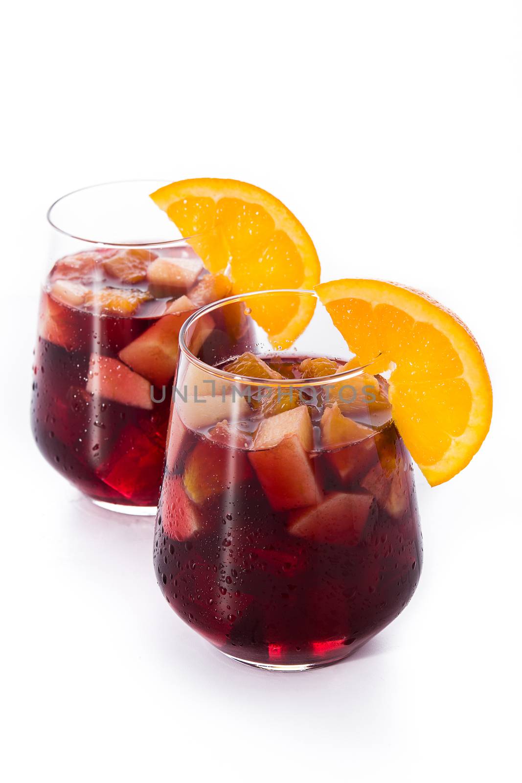 Red wine sangria in glass isolated on white background