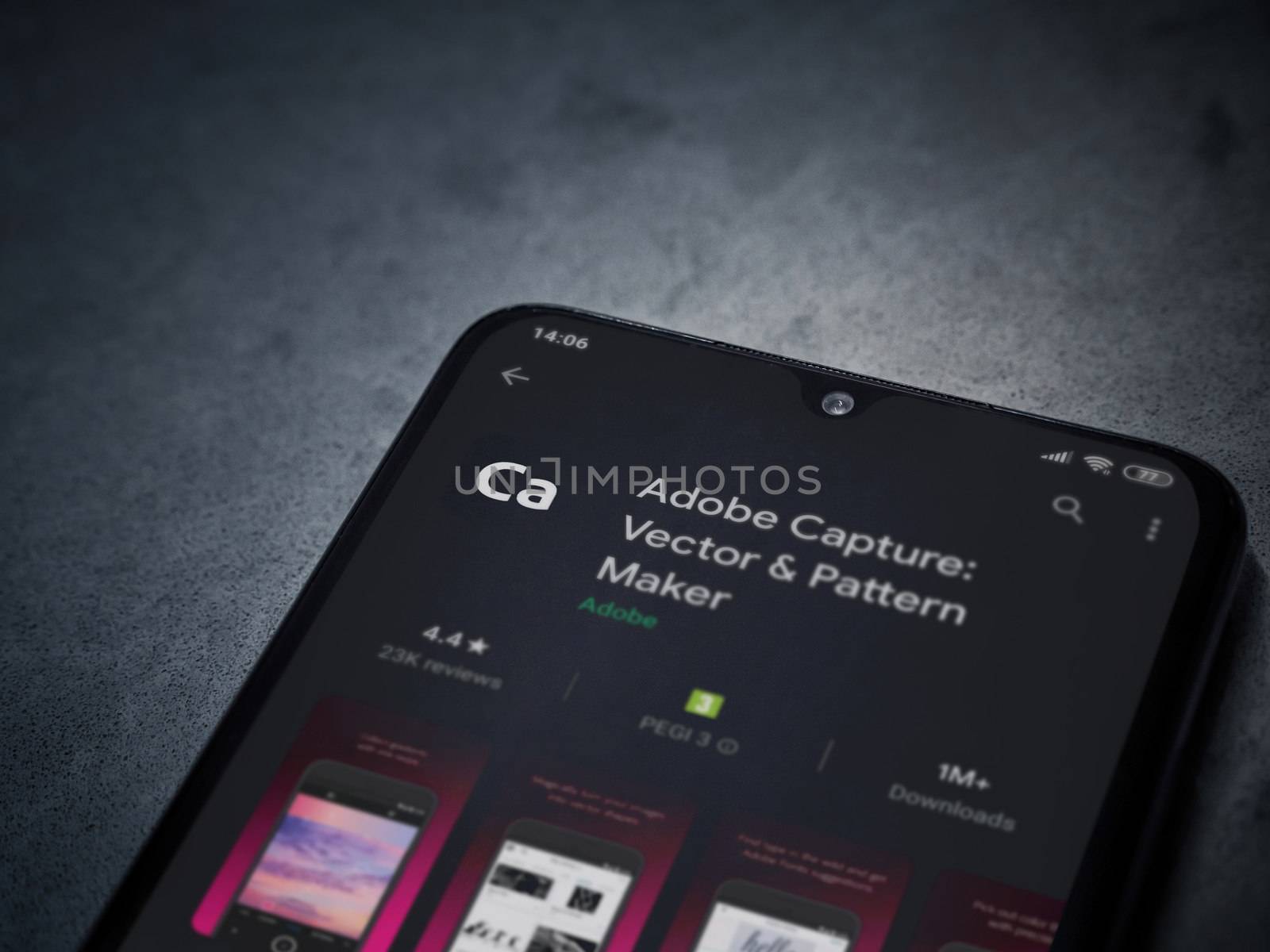 Lod, Israel - July 8, 2020: Adobe Capture - Vector and Pattern Maker app play store page on the display of a black mobile smartphone on a dark marble stone background. Top view flat lay with copy space.