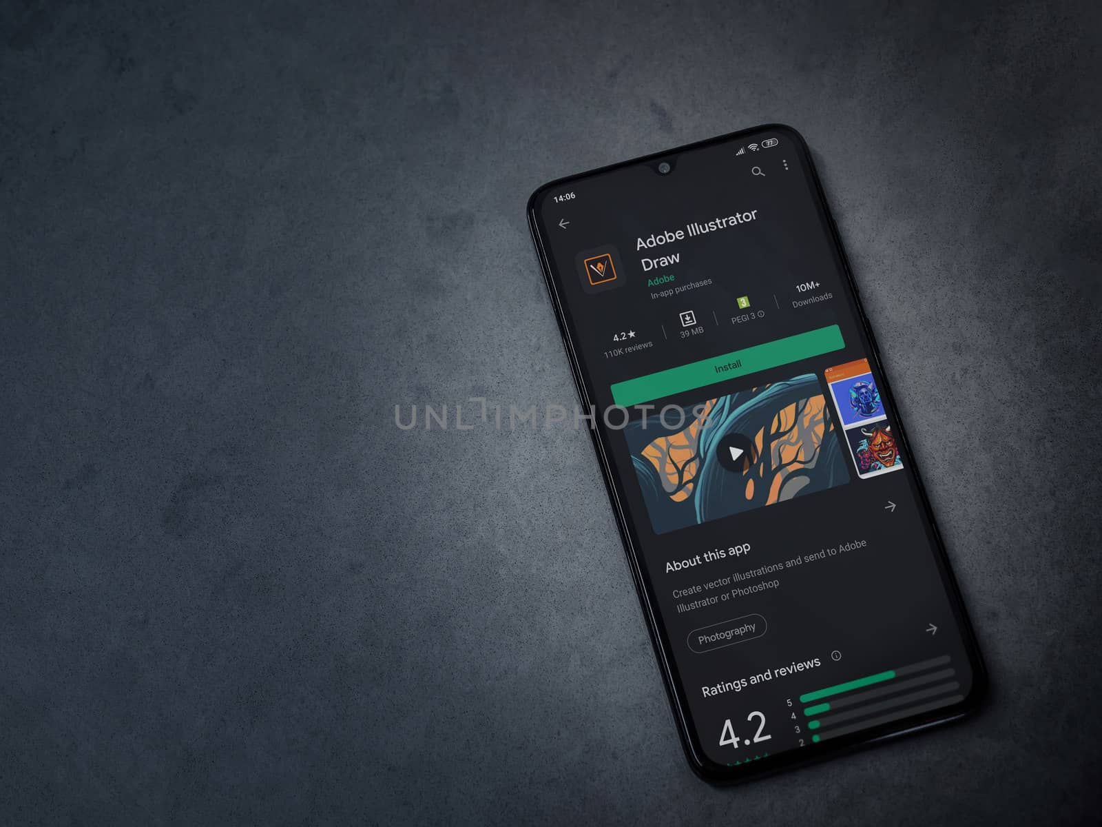 Lod, Israel - July 8, 2020: Adobe Illustrator Draw app play store page on the display of a black mobile smartphone on a dark marble stone background. Top view flat lay with copy space.