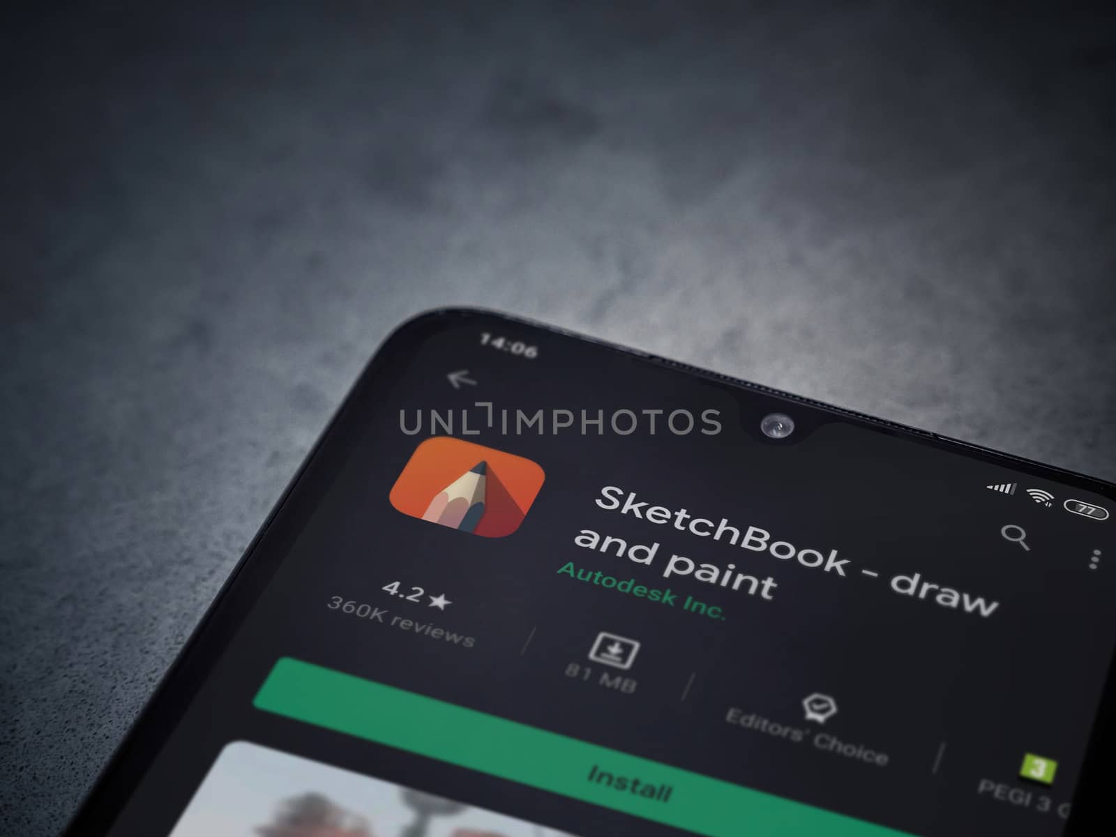 Lod, Israel - July 8, 2020: Autodesk SketchBook - draw and paint app play store page on the display of a black mobile smartphone on a dark marble stone background. Top view flat lay with copy space.