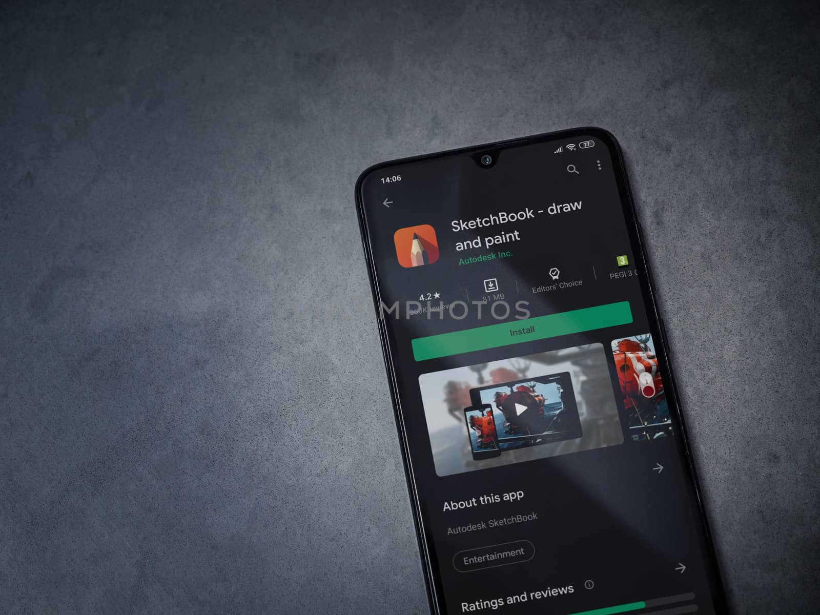 Lod, Israel - July 8, 2020: Autodesk SketchBook - draw and paint app play store page on the display of a black mobile smartphone on a dark marble stone background. Top view flat lay with copy space.