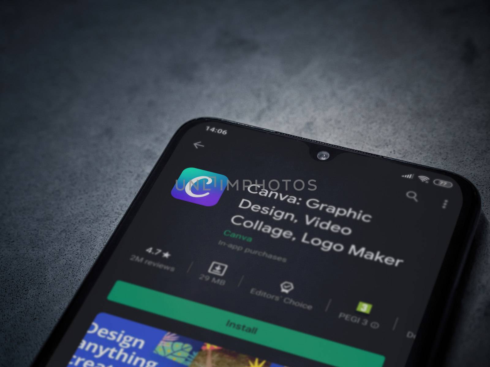 Lod, Israel - July 8, 2020: Canva - Graphic Design app play store page on the display of a black mobile smartphone on a dark marble stone background. Top view flat lay with copy space. 