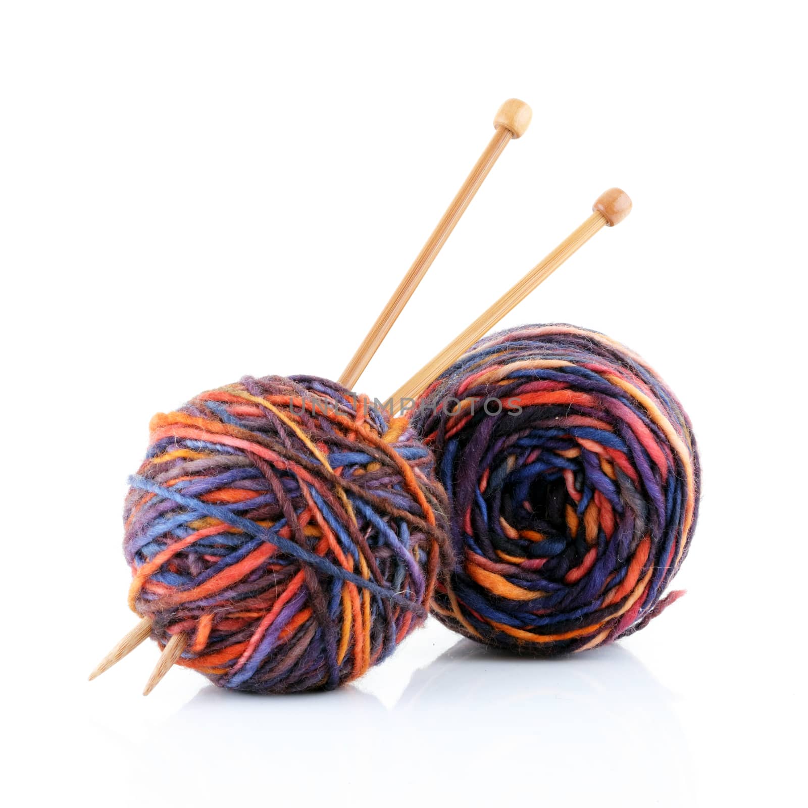 Two balls of wool with knitting needles by VivacityImages