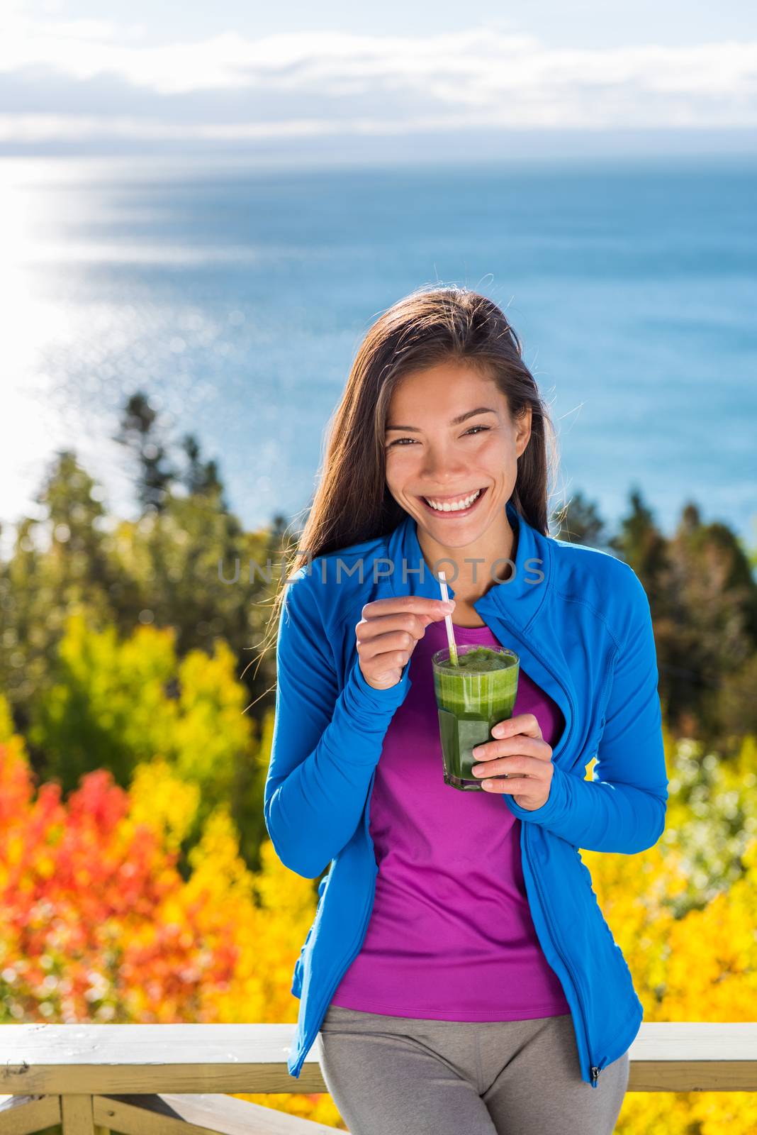 Healthy food autumn woman drinking green smoothie by Maridav