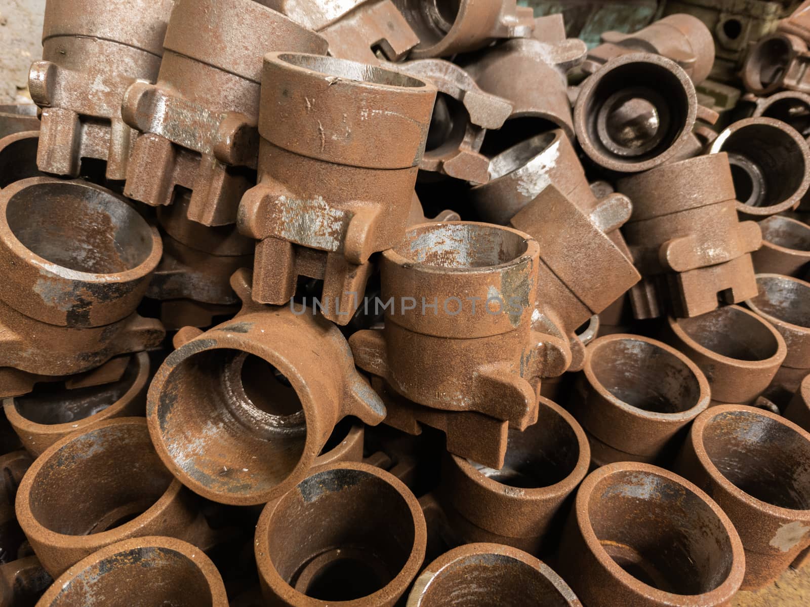 rusted metal parts close-up background with selective focus. improper factory storage issue
