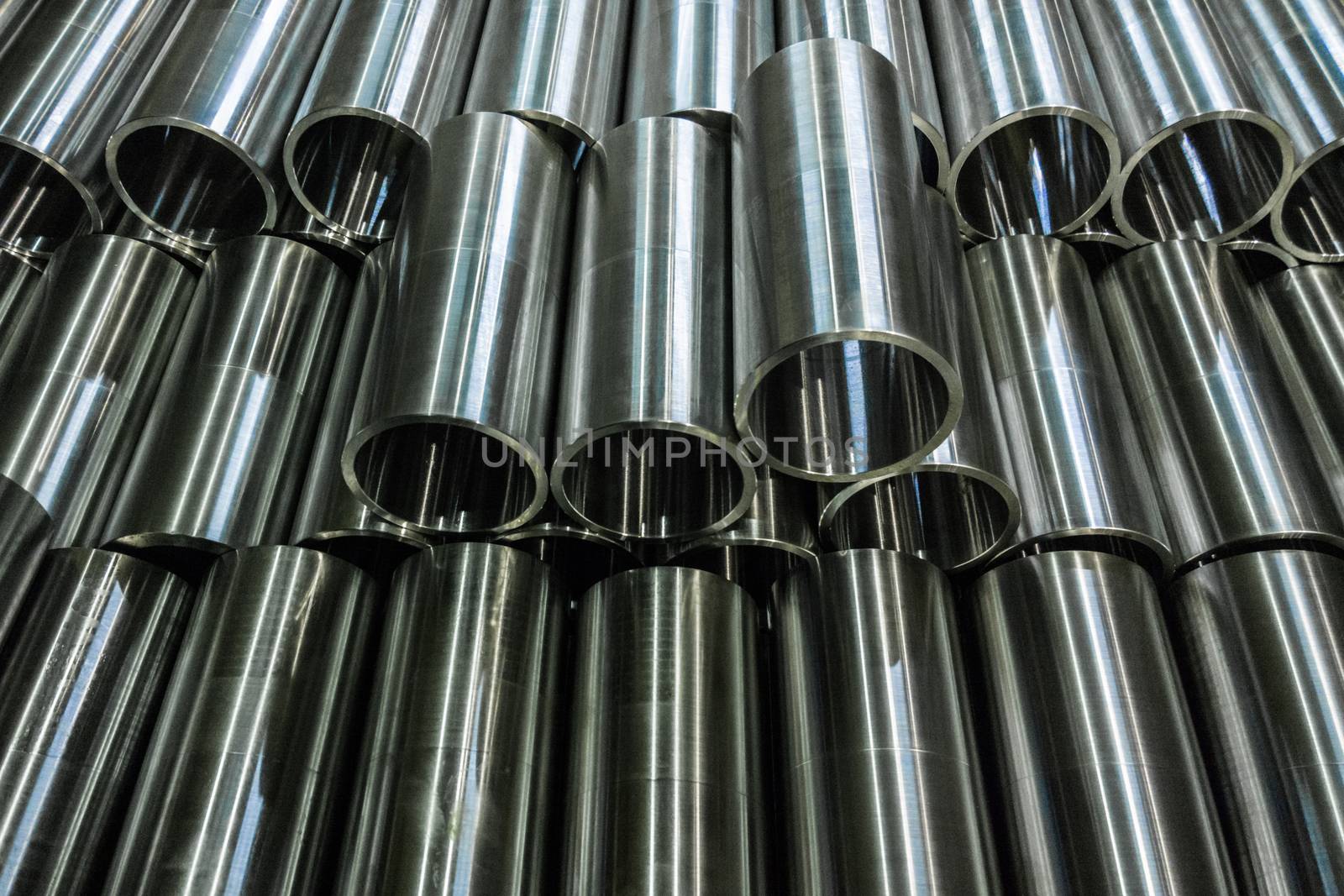 unadorned photo of cnc turned shiny steel pipes.