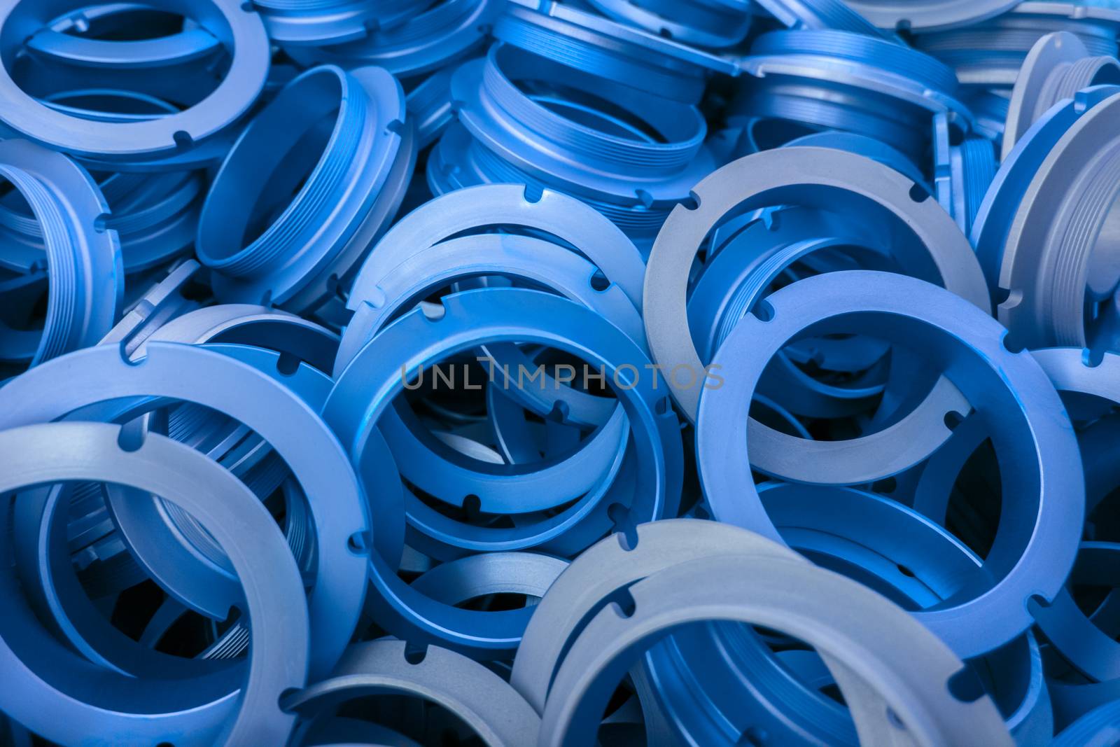 an abstract background of classic blue color coated metal ring parts by z1b