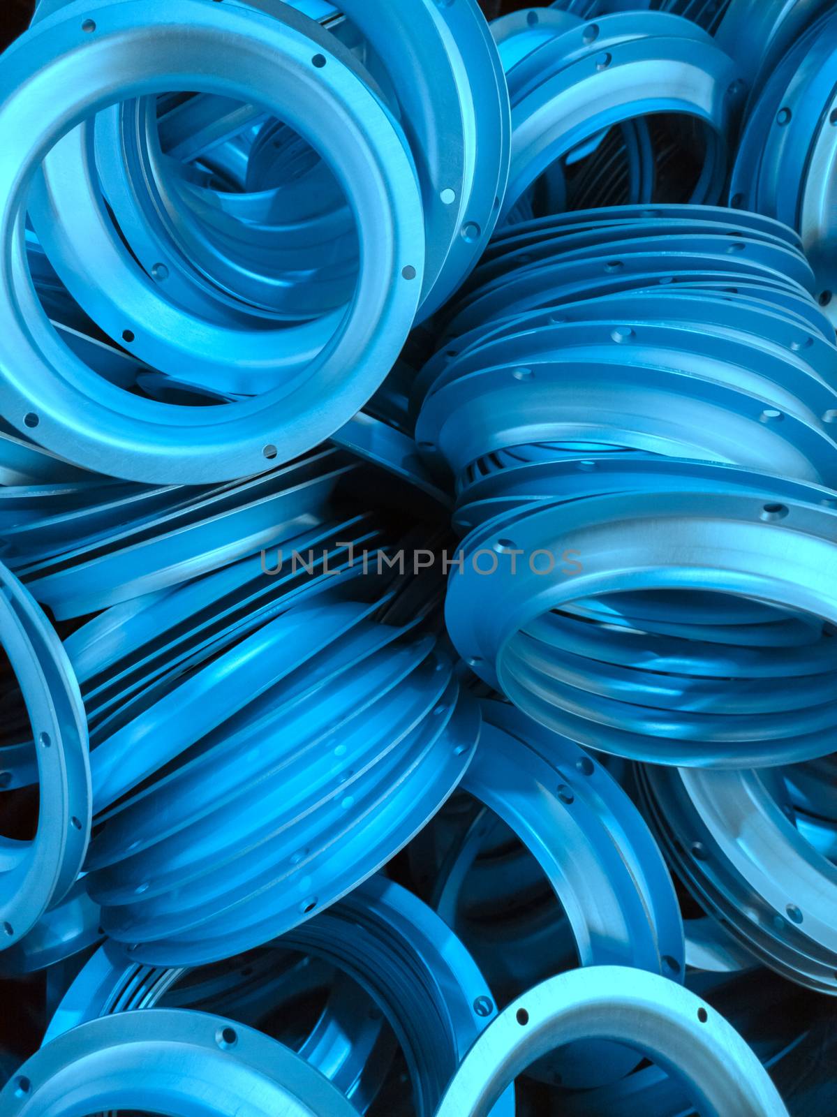 a batch of phantom blue colored anodized aluminium parts.