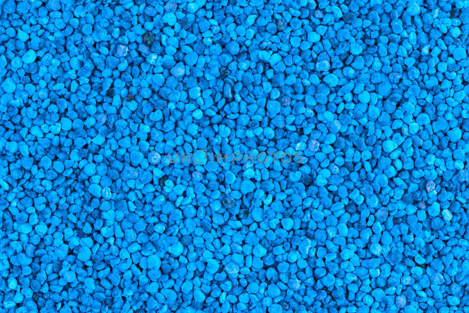 seamless flat texture and background of blue toned granules of bee pollen.