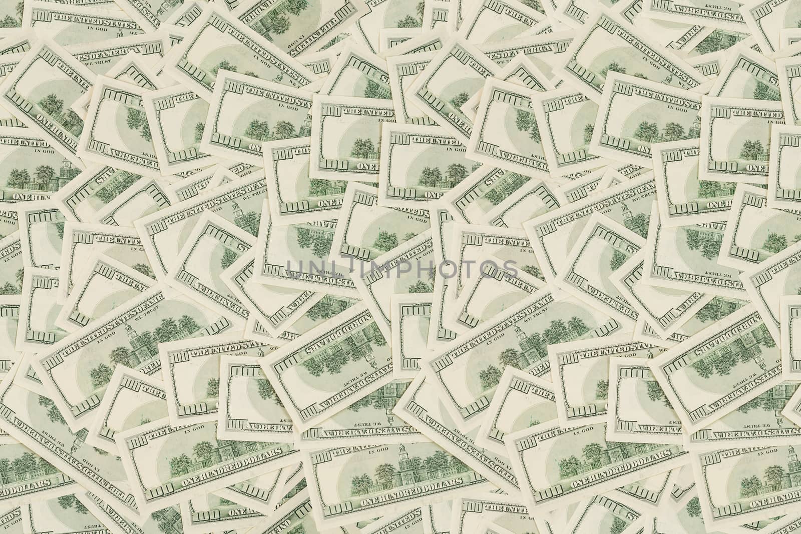 flat seamless texture and background of real one hundred united states of america dollar banknotes, back reverse side in random pattern