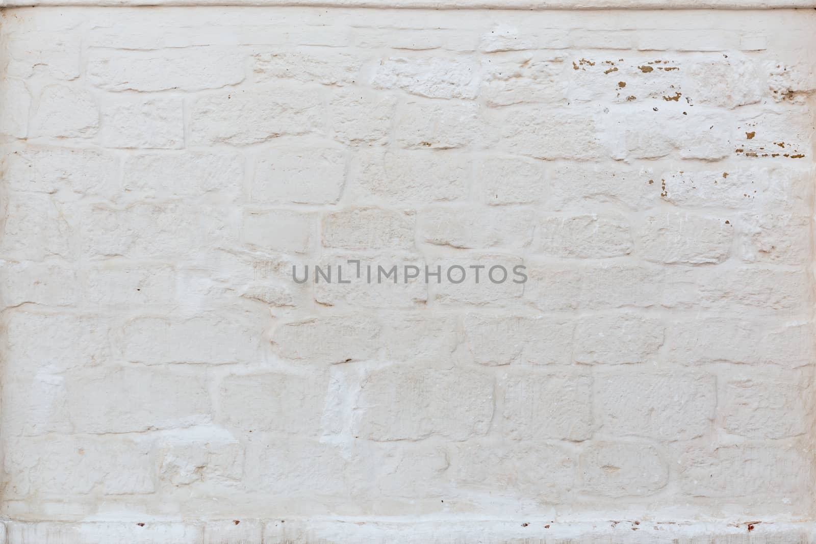 whitewash brick wall horizontal background with side sunlight