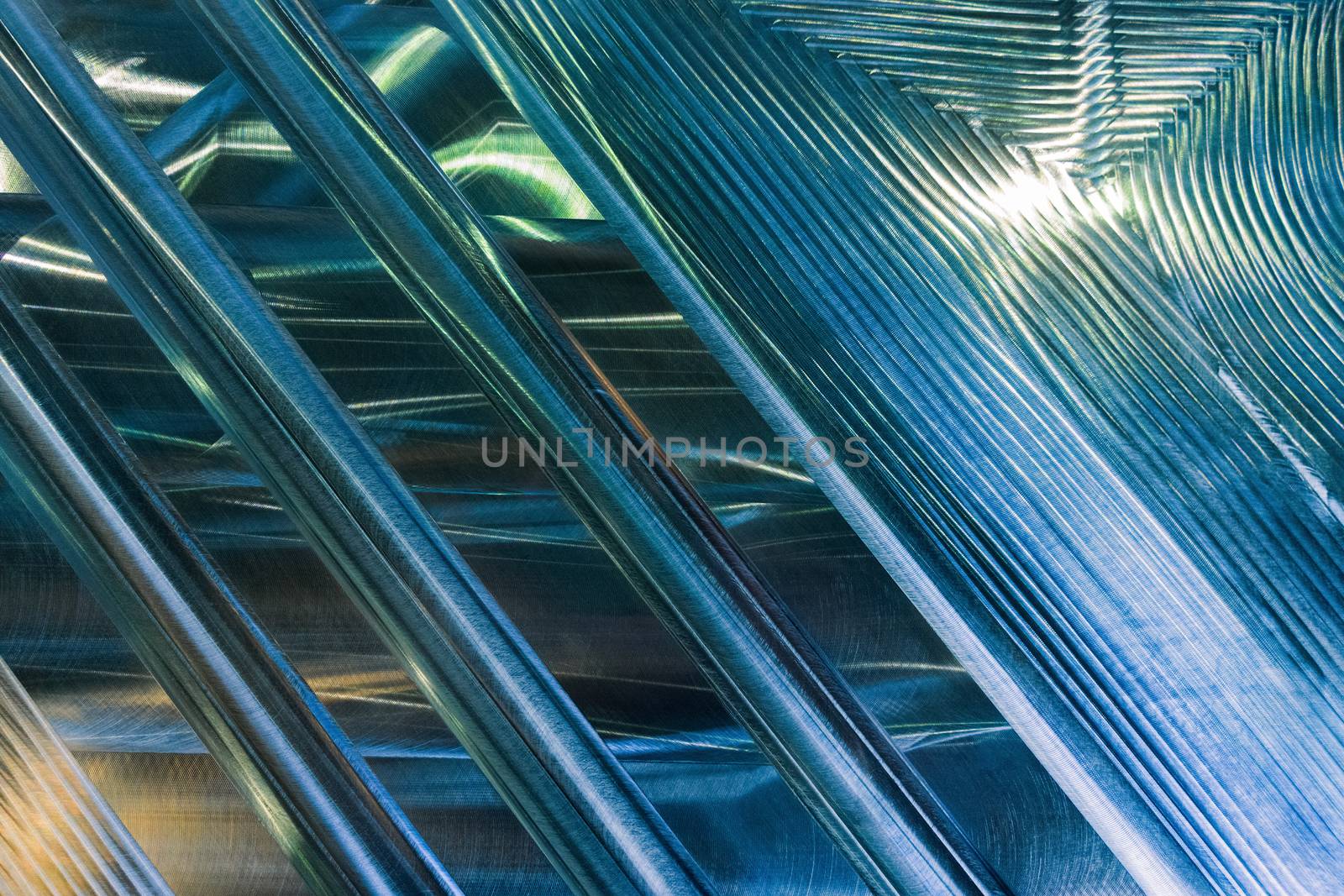 Large metal surface after end milling with specific concentric notches and light reflections. Selective focus closeup technique