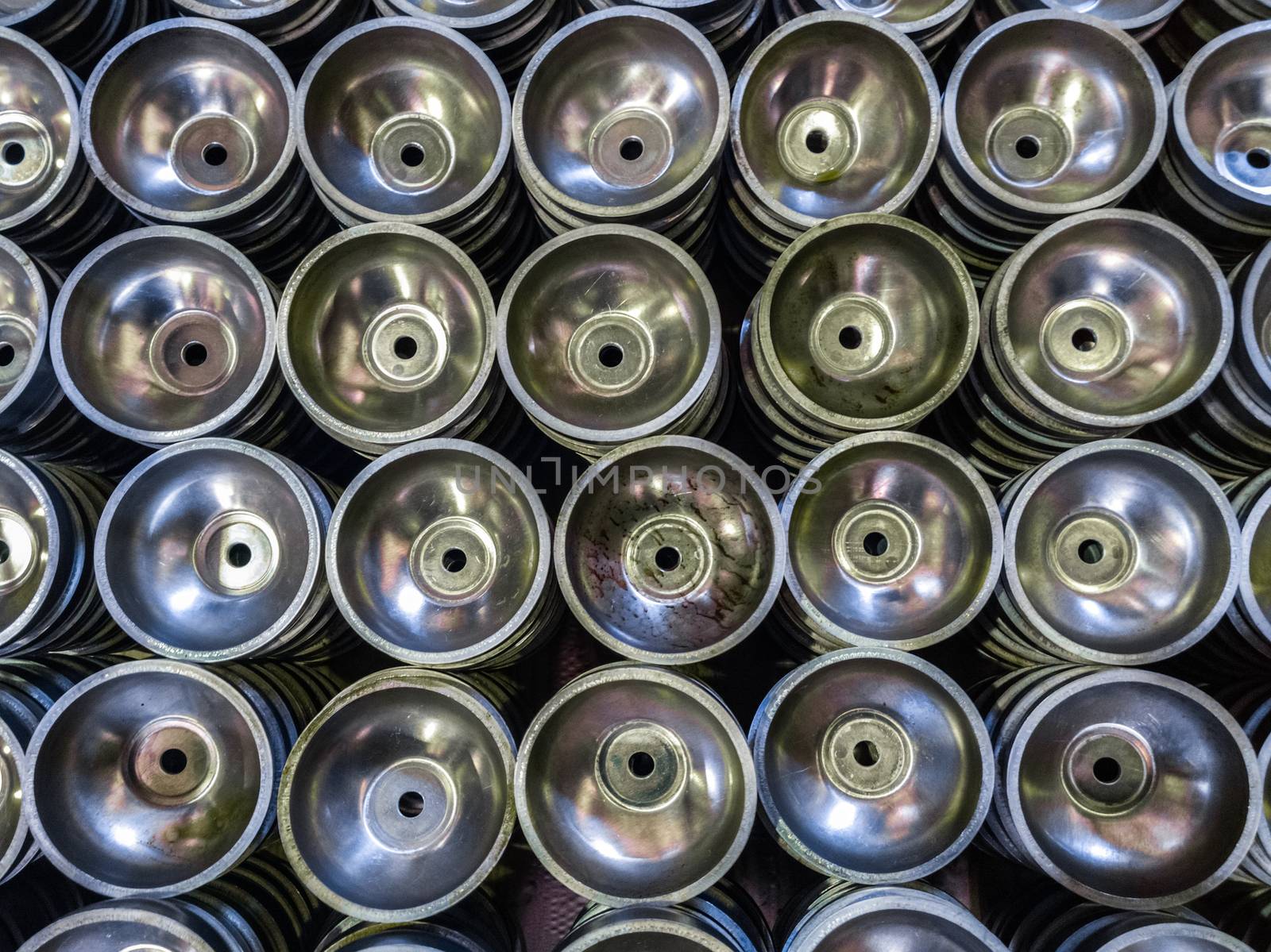 batch of thick alluminium stamped half-spherical parts.