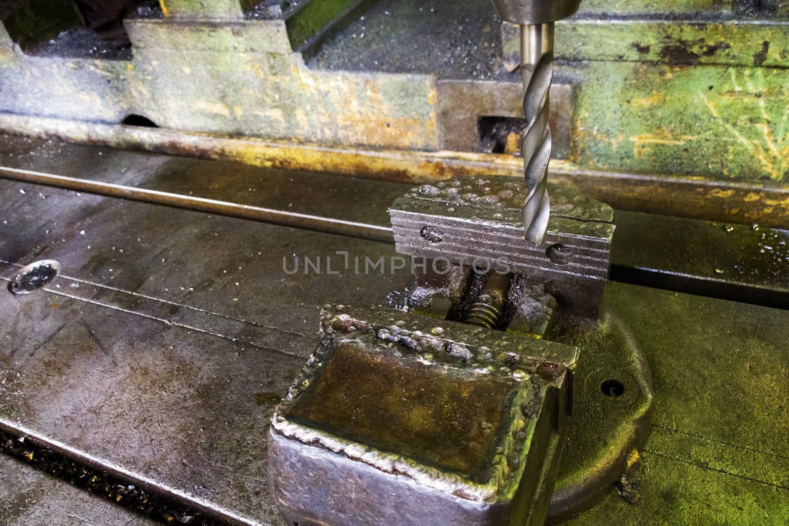 old drilling machine with obsolete used vice with selective focus.