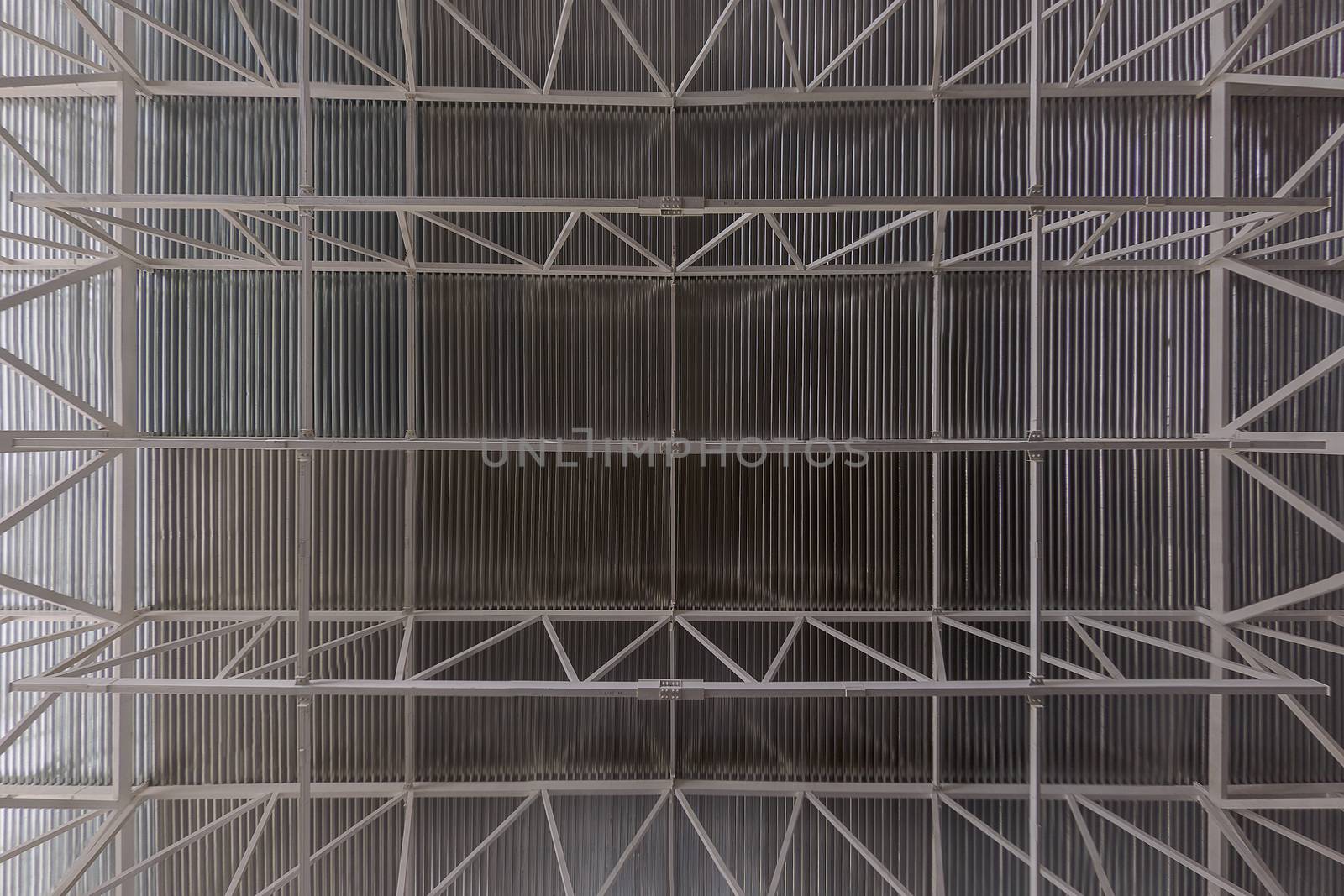 Industrial ceiling with profiled sheet and girder beam system flat zenith wide angle background.