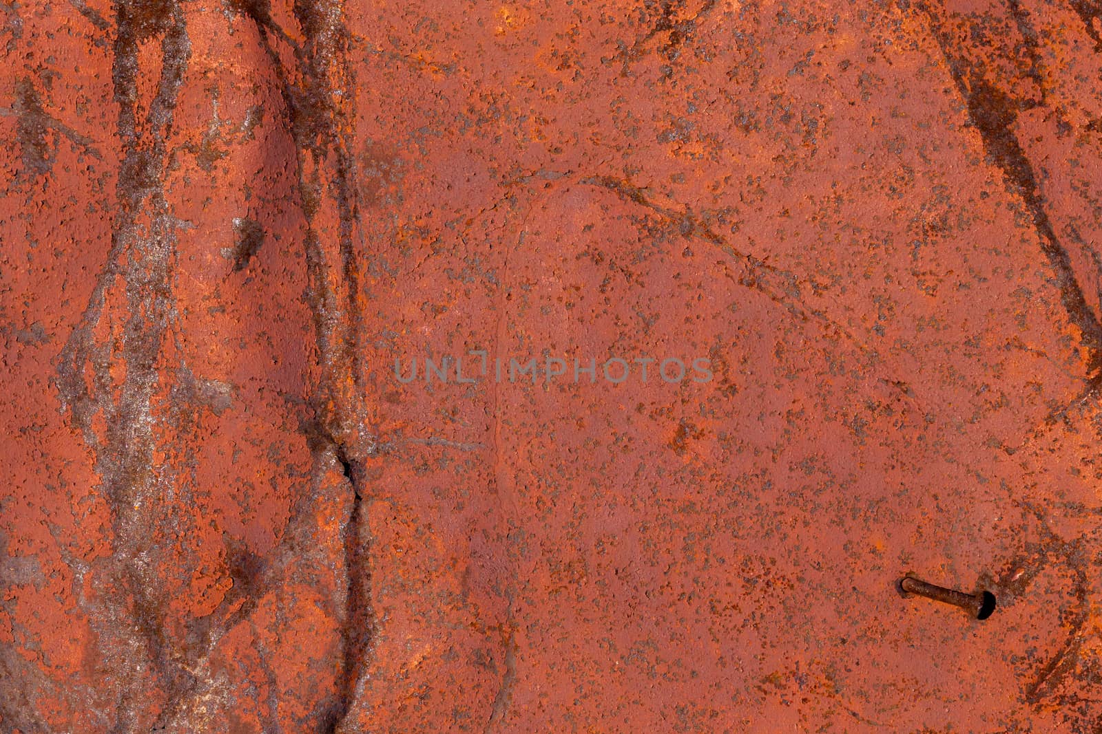 Weathered brown painted metal wall. Abstract background and rough texture.