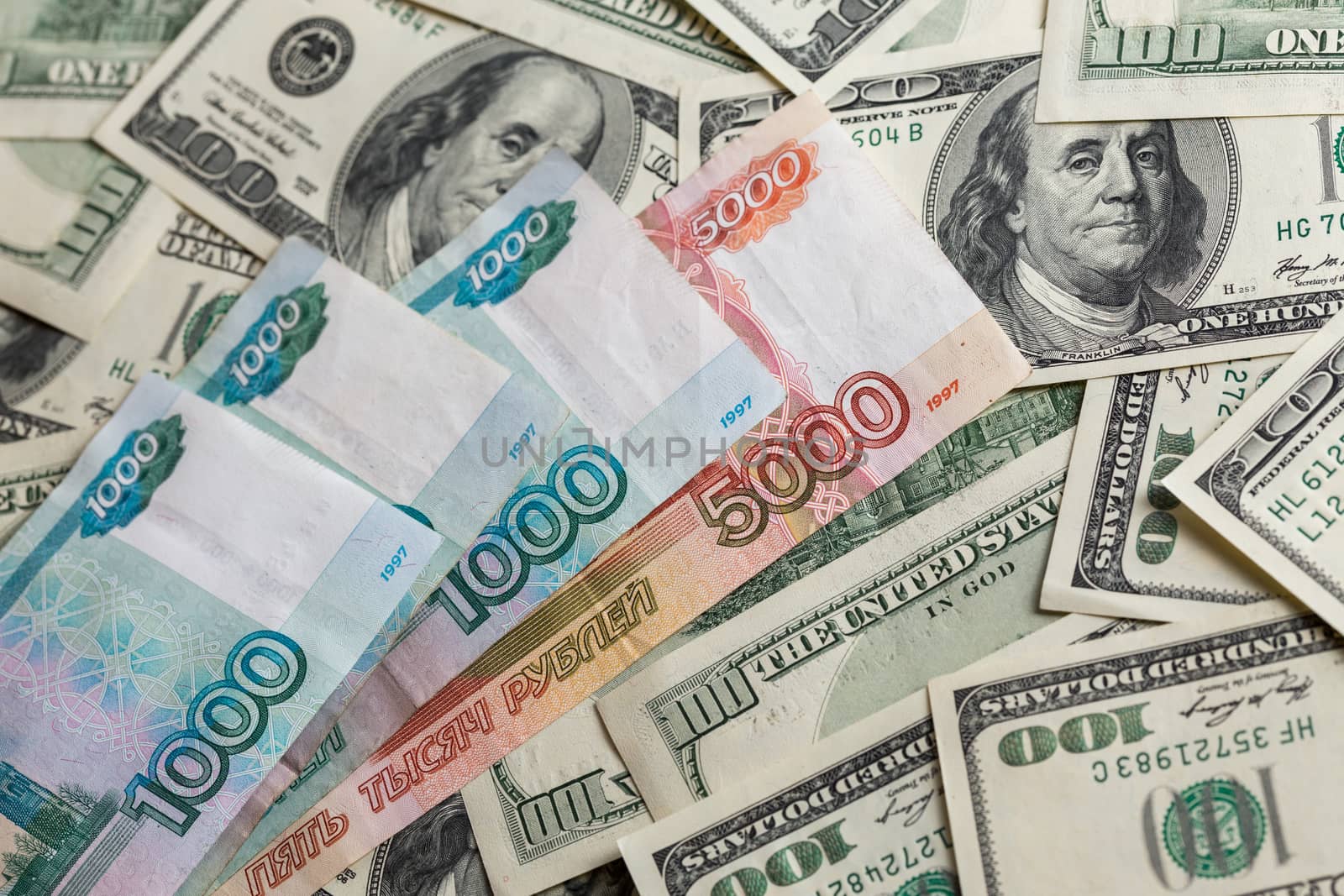 russian rubl and us dollar banknotes close-up with selective focus and blur