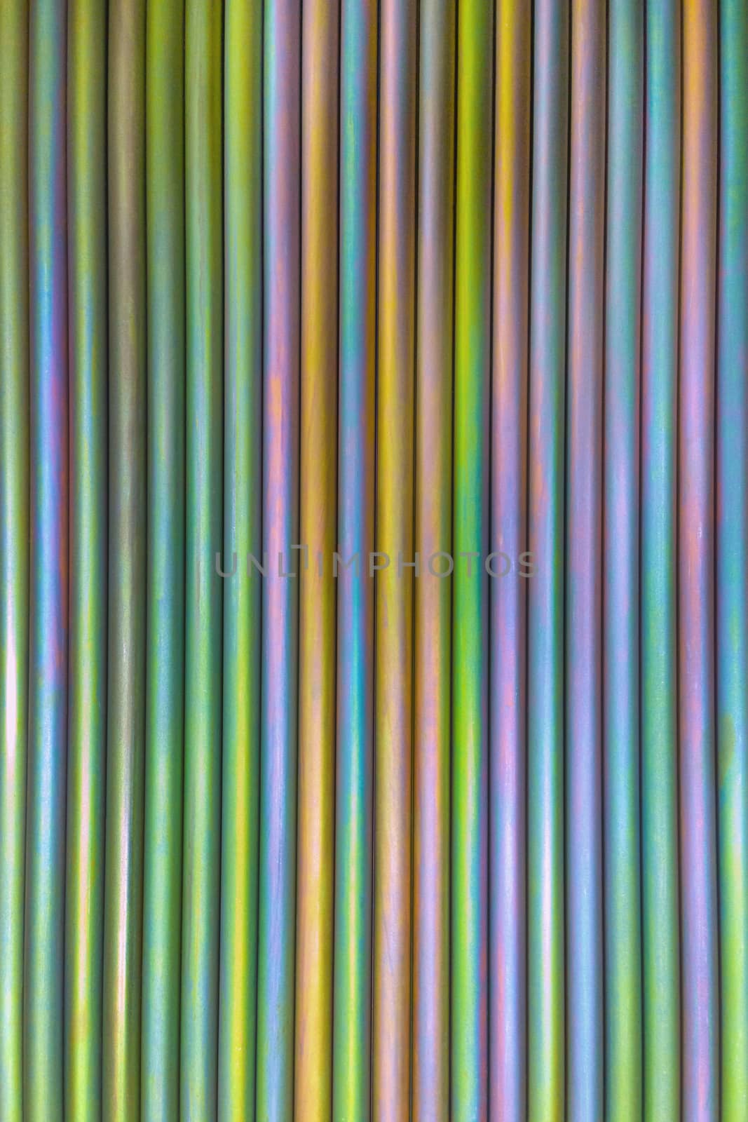 An abstract lines backround of colorful cadmium coated steel bars. Industrial grade chemical protective coating for metal parts.
