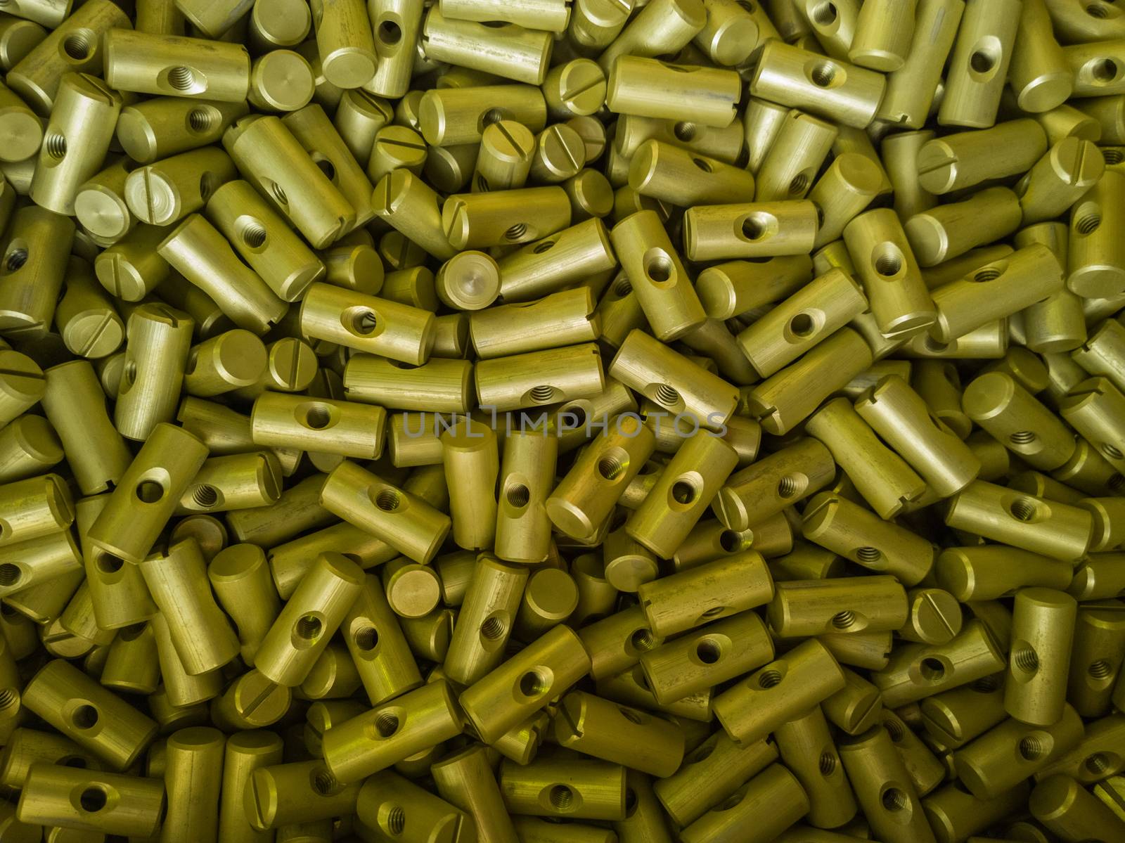 A batch of small sulfur oxidated anodized aluminium parts - mass production background