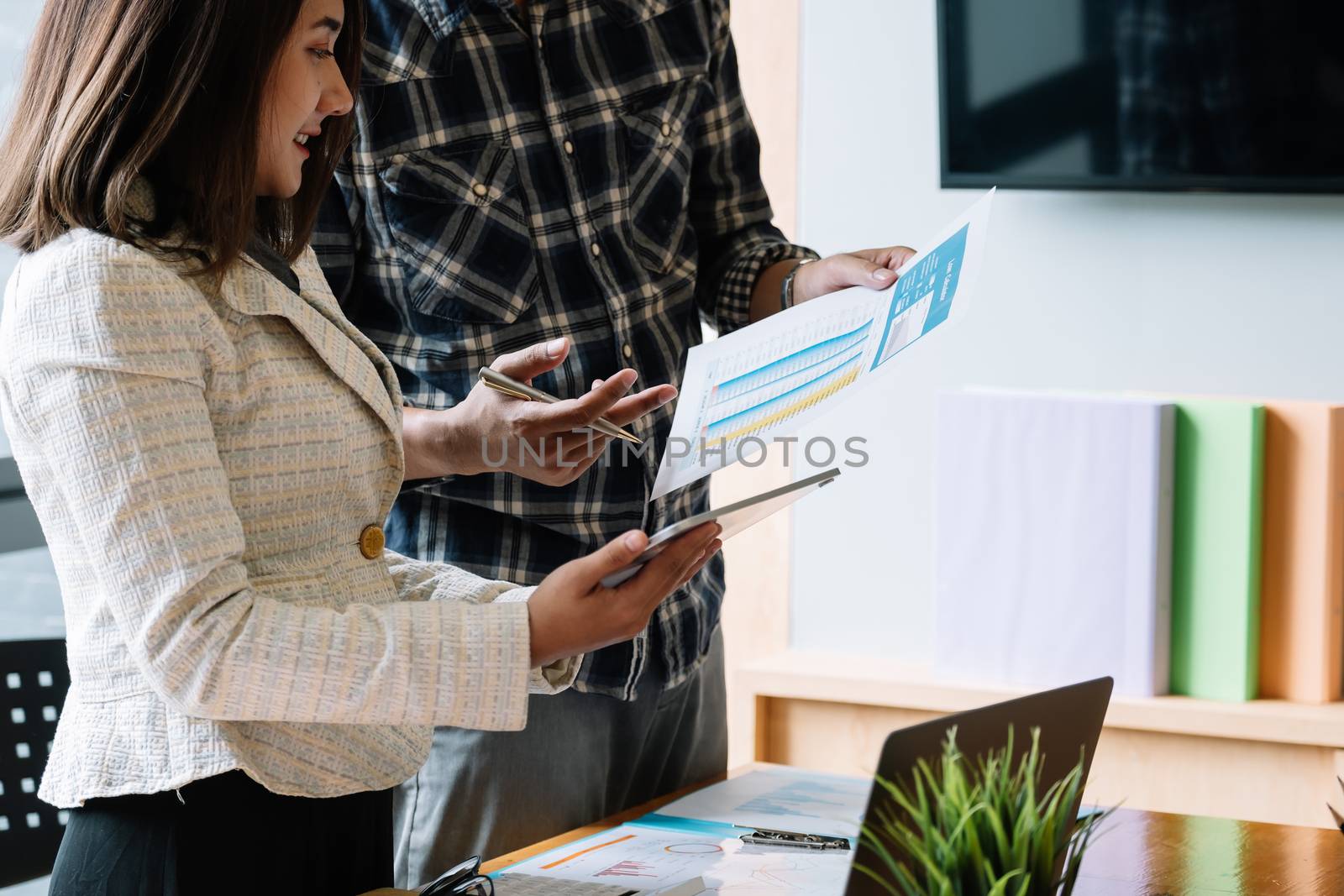 Business people meeting to discuss the situation on the market with tablet computer.