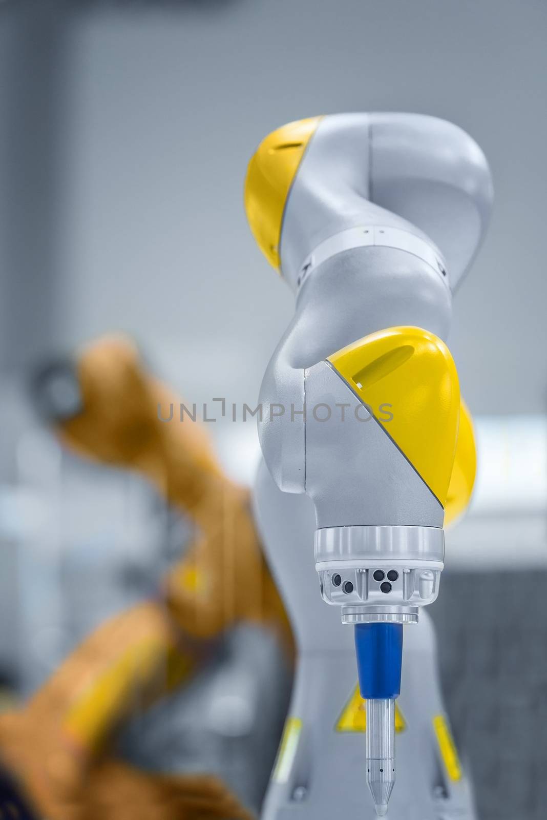 High technology robotic arm closeup photo in factory