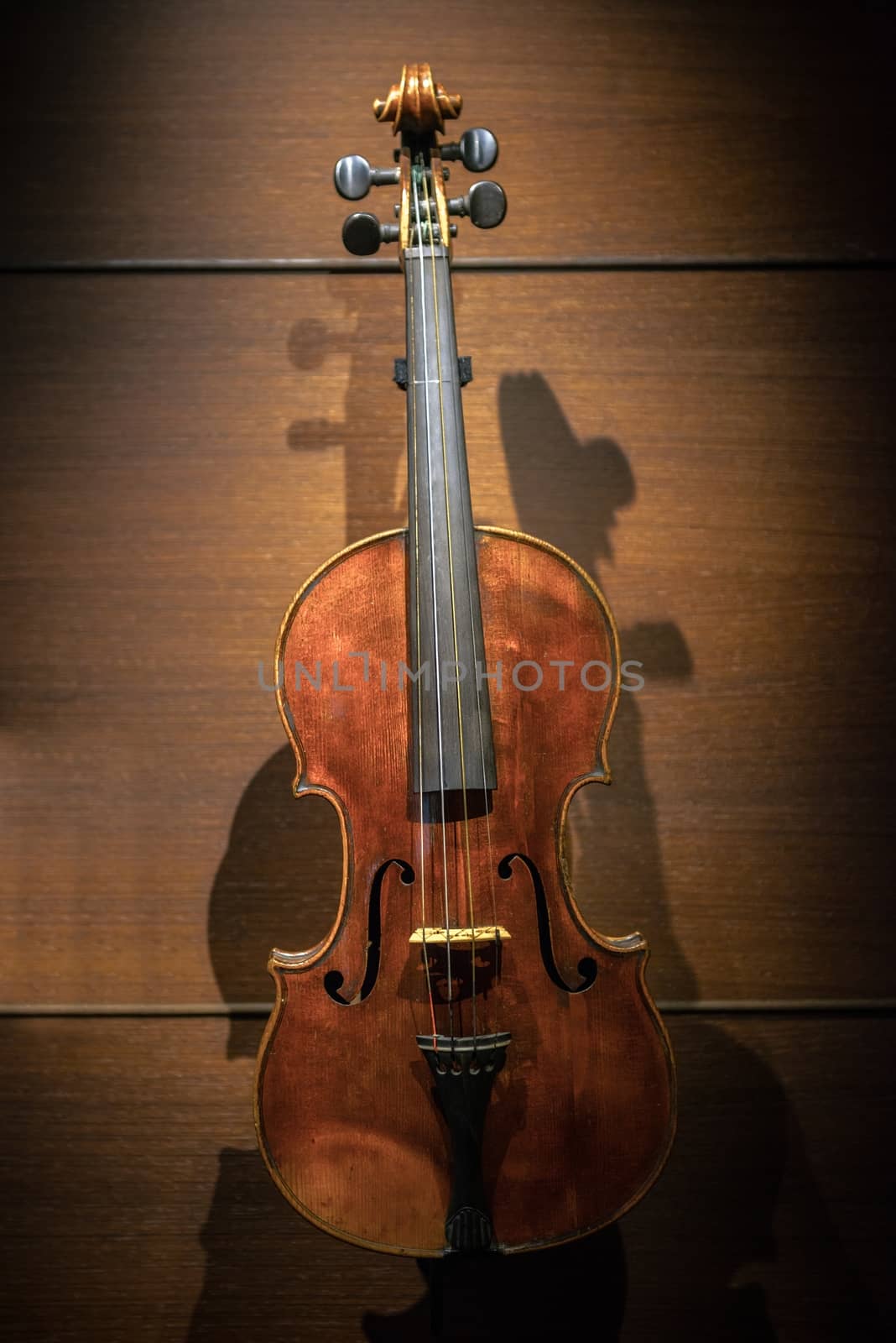 Closeup photo of an aged musical instrument violin