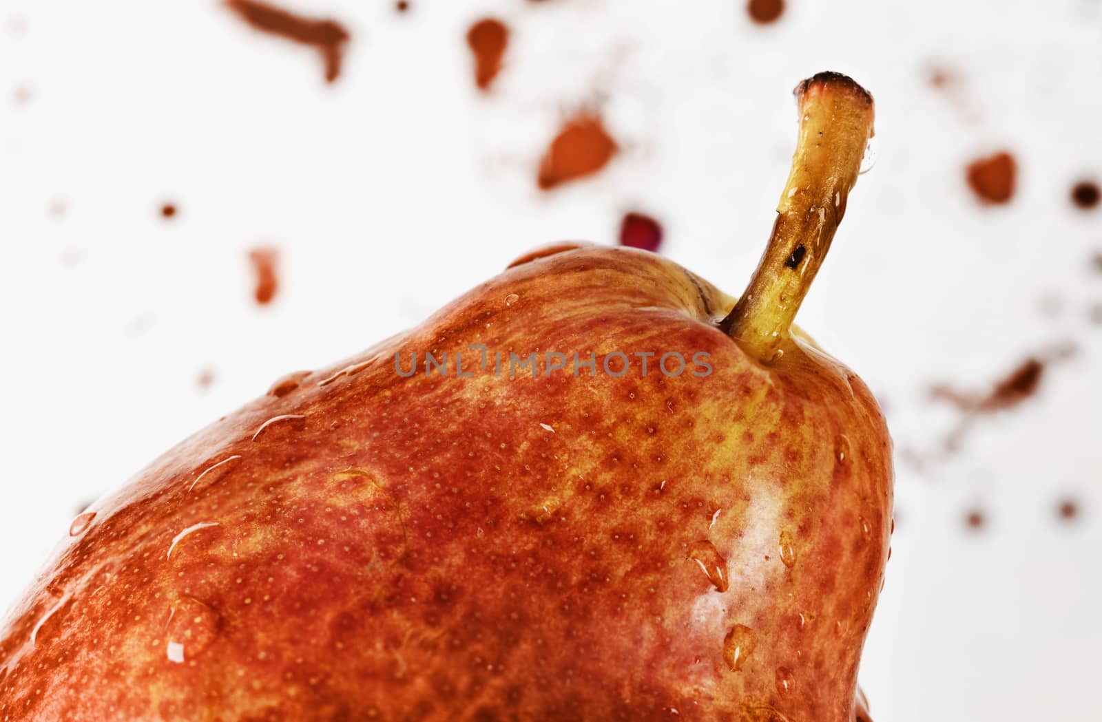 Beautiful orange pear on white background ,unpeeled fruit with water drops