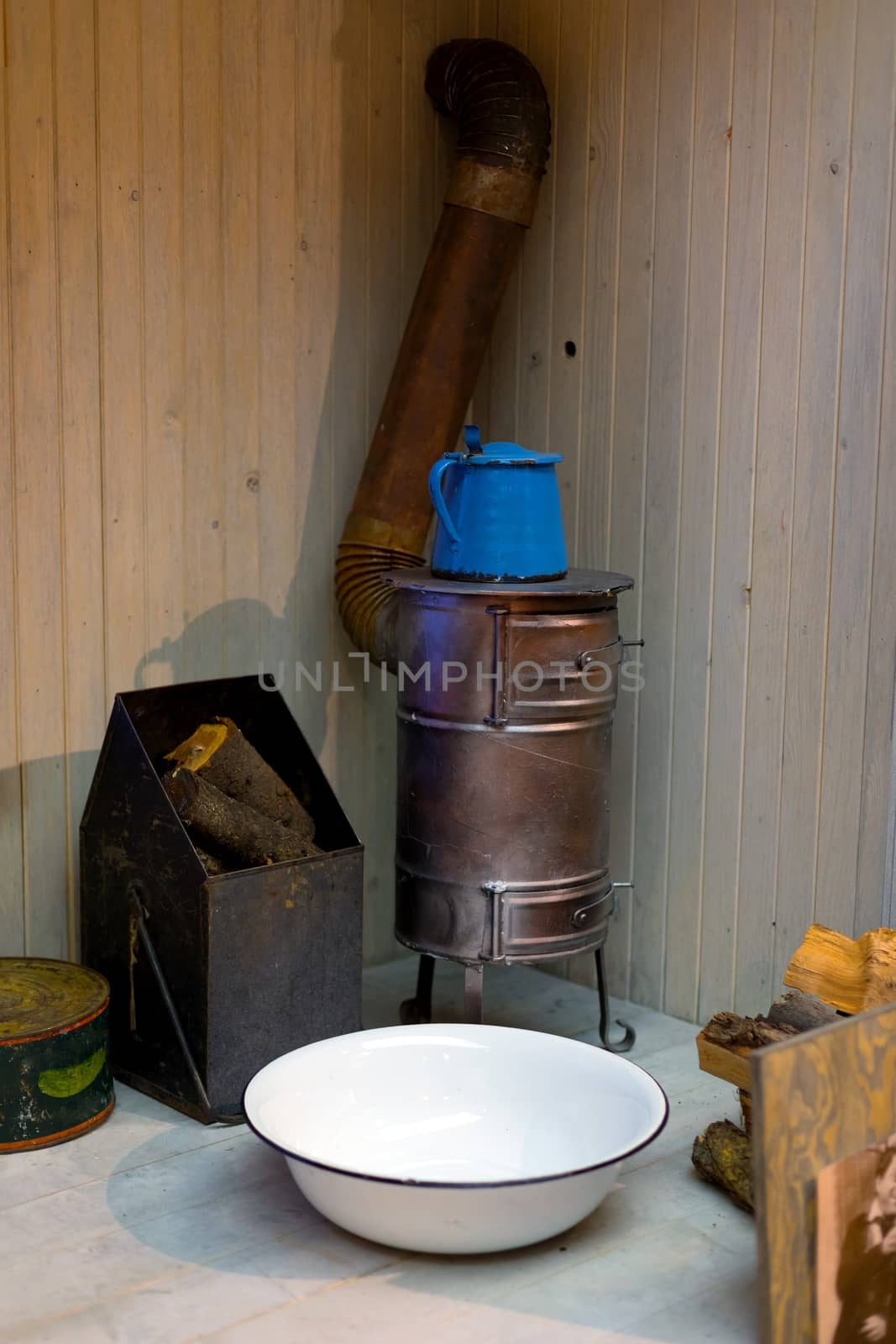 Old vintage heating equipment closeup photo with basin and fireplace