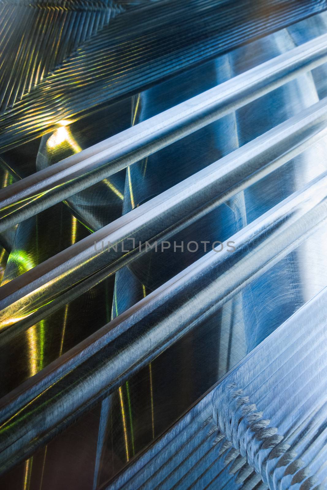 Large metal surface after end milling by large shell mill with specific concentric notches and light reflections. Selective focus closeup technique