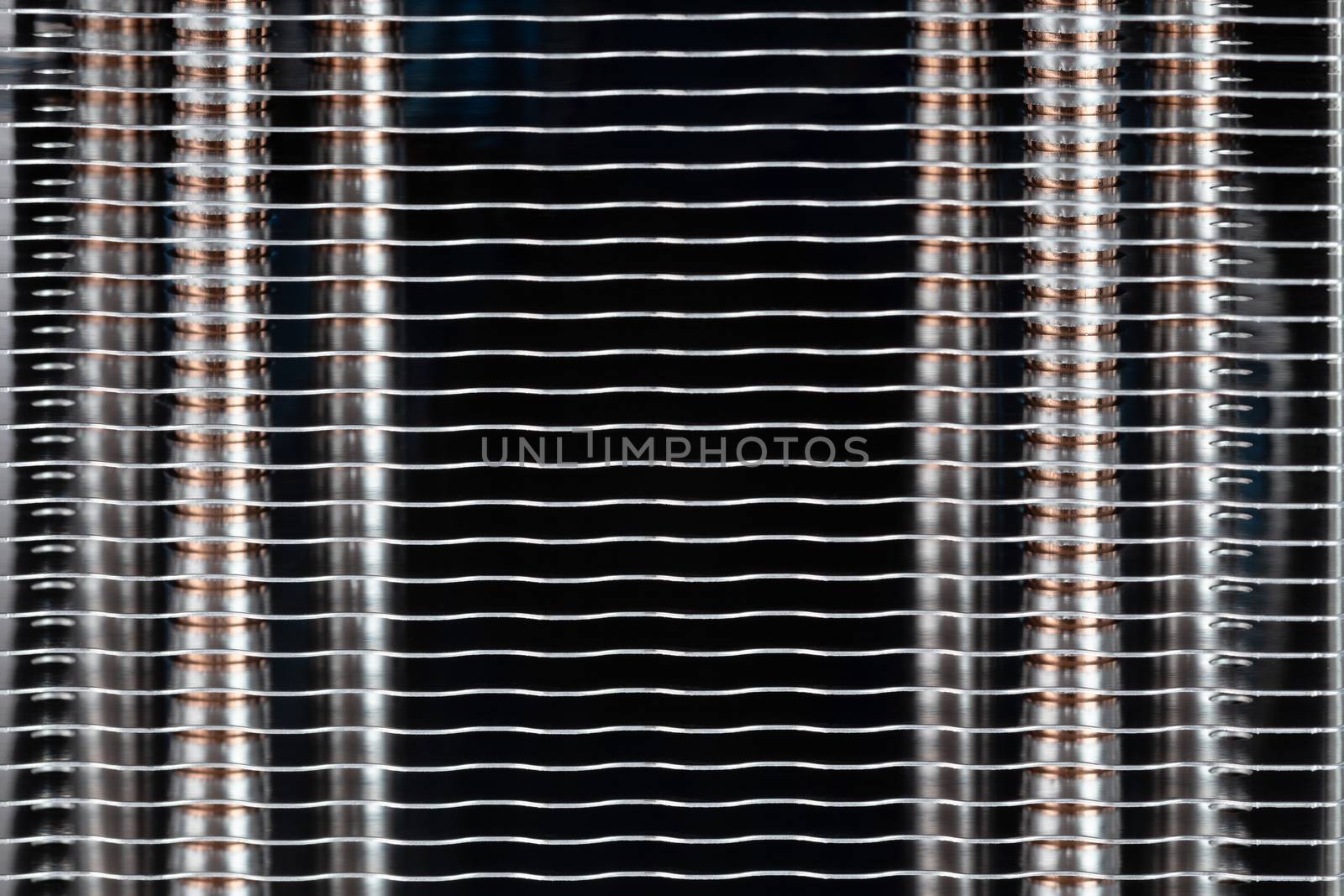 Abstract heat radiator closeup. Modern tower heat sink with heatpipes inside closeup macro background with selective focus and horizontal composition.