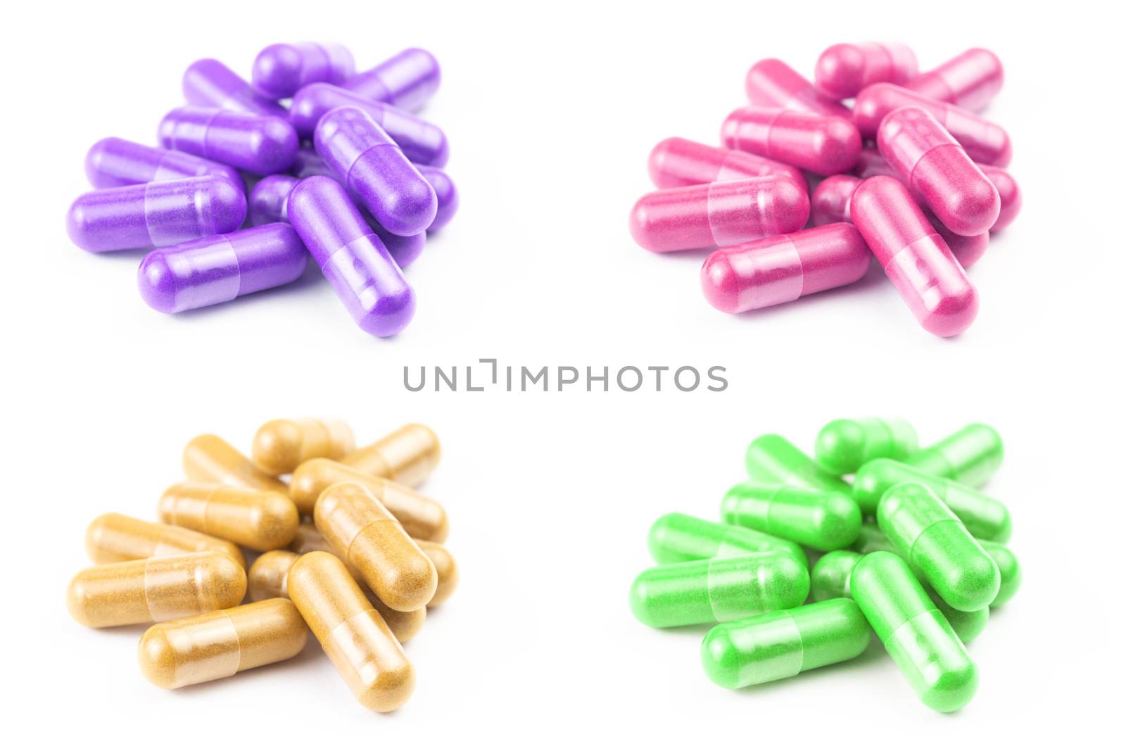 set of of colored organic capsules isolated on white background closeup with selective focus.