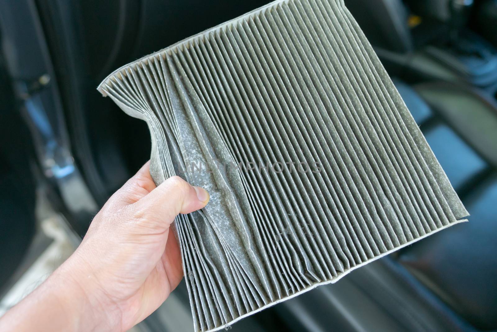 hand hold dirty car air conditioning filter 