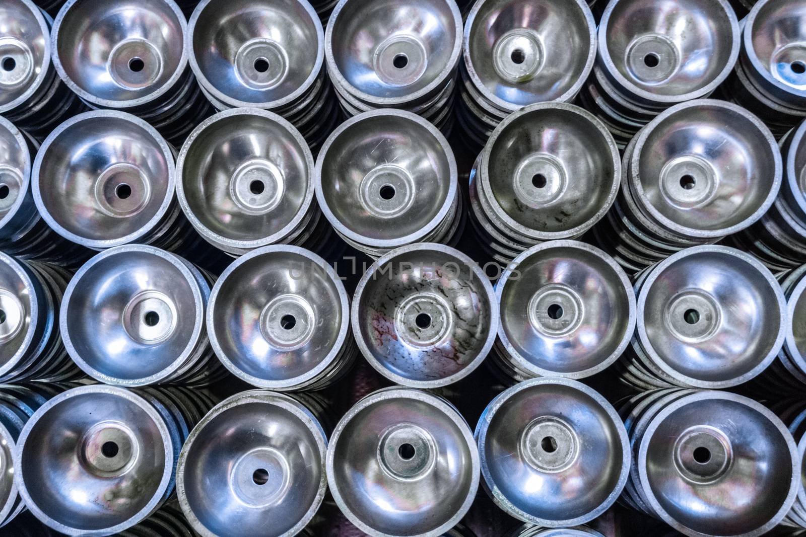 batch of thick alluminium stamped half-spherical parts.