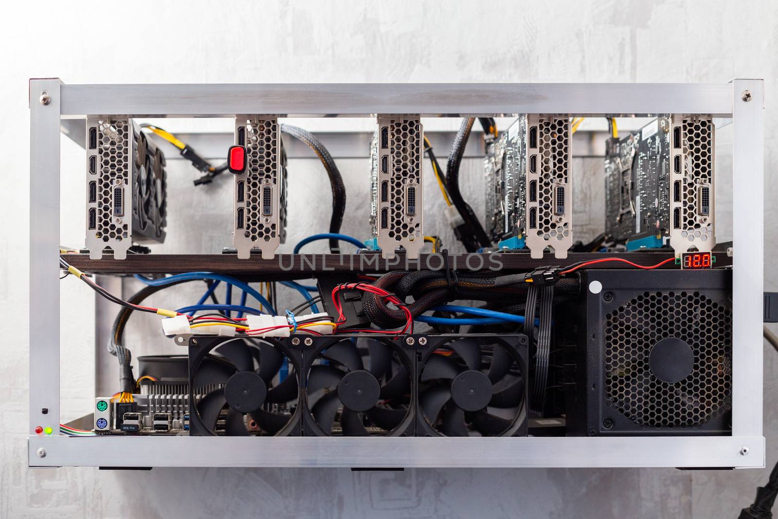 domestic gpu cripto mining rig on wall with selective focus.