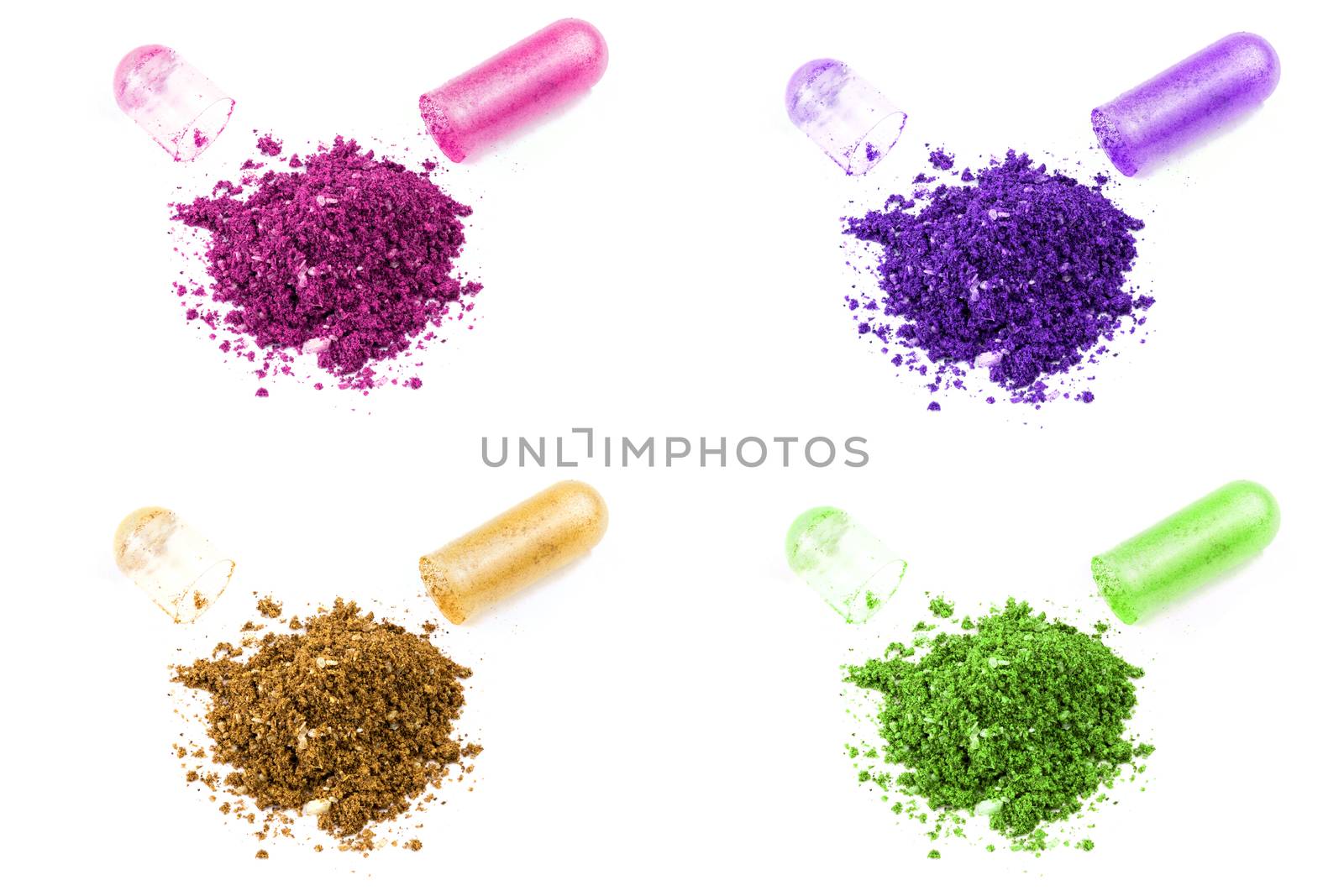 opened colored organic med capsule isolated on white background closeup.