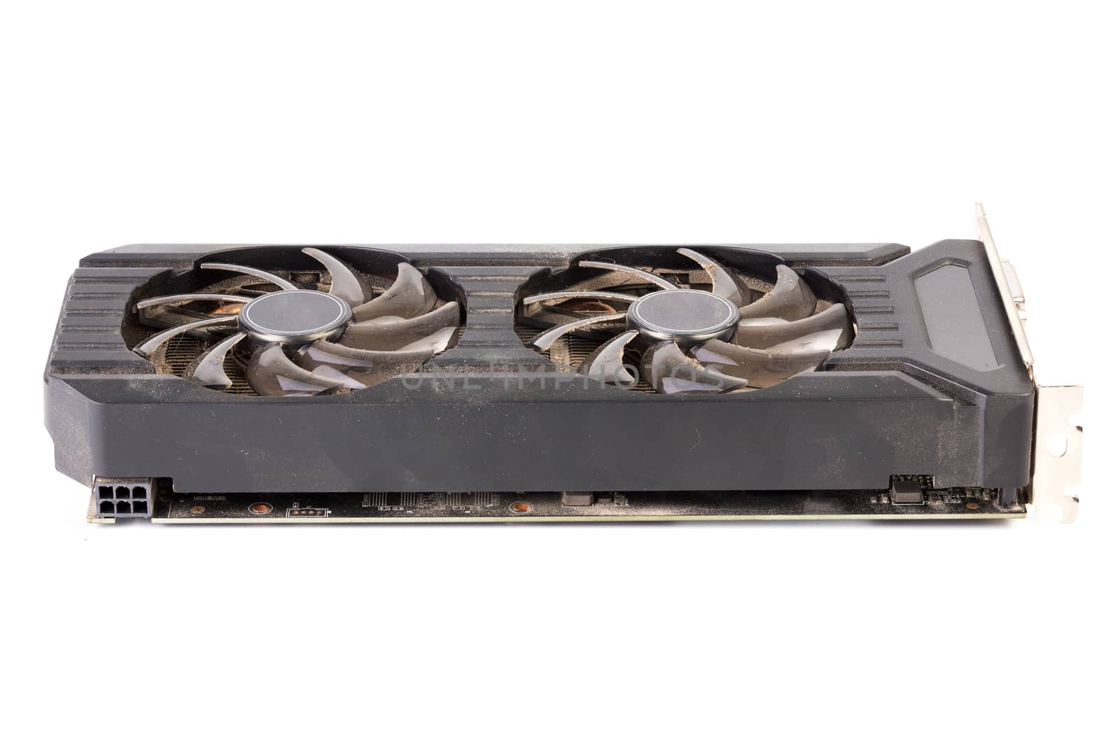 Used and dusty black PC video card isolated on white background.