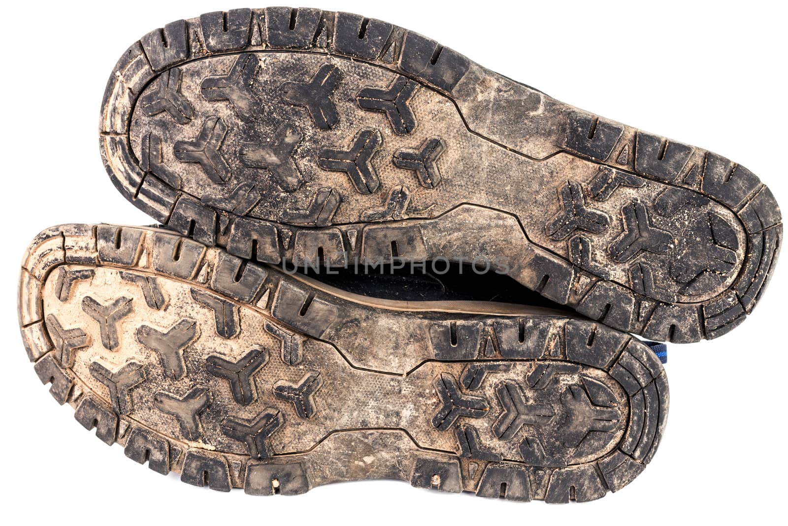 dirty used worn out black outdoor sneakers sole isolated on white.