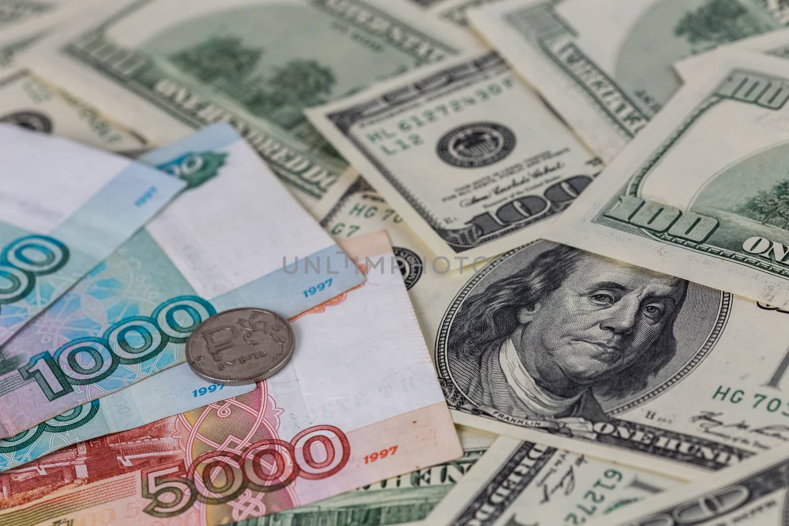 us dollars and russian rubles close-up background with selective focus.