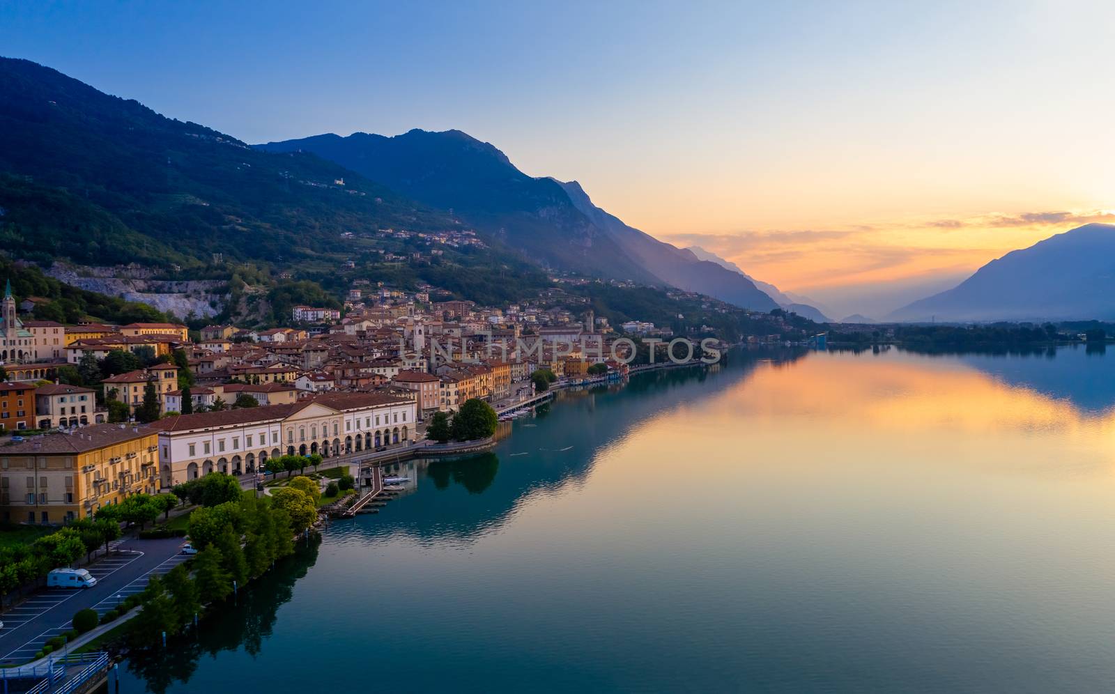 Aerial view of Lake Iseo at sunrise, on the left the city of lovere which runs along the lake,Bergamo Italy.