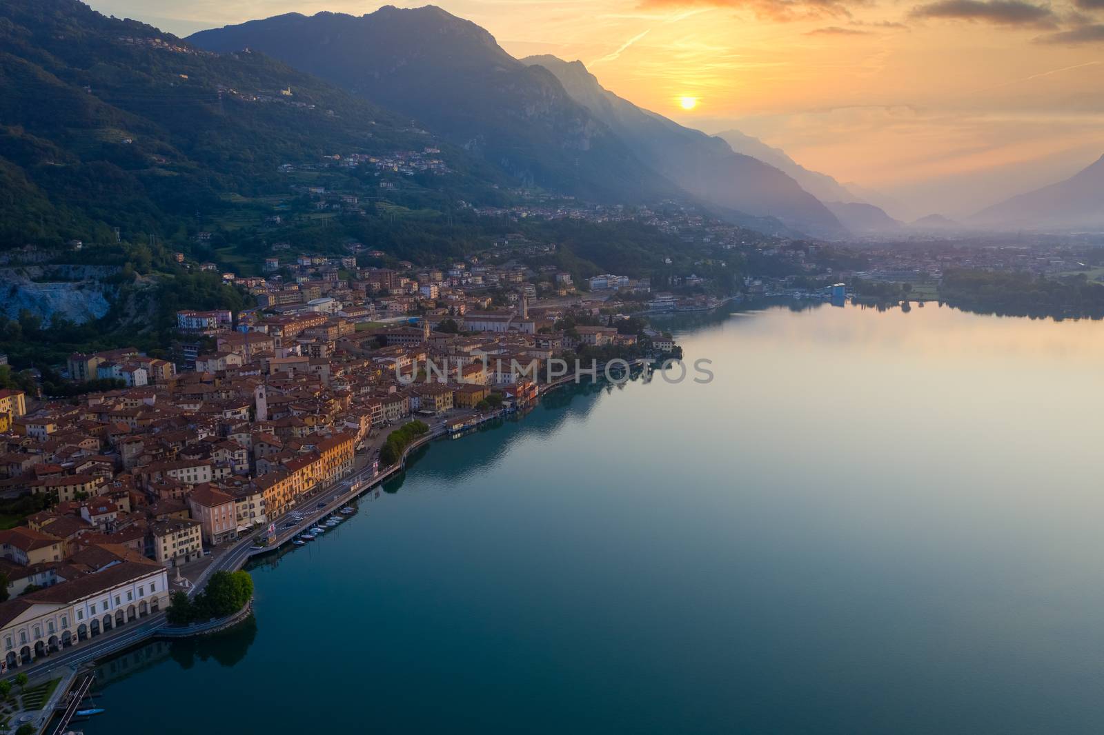 Aerial view of Lake Iseo at sunrise, on the left the city of lovere which runs along the lake,Bergamo Italy.