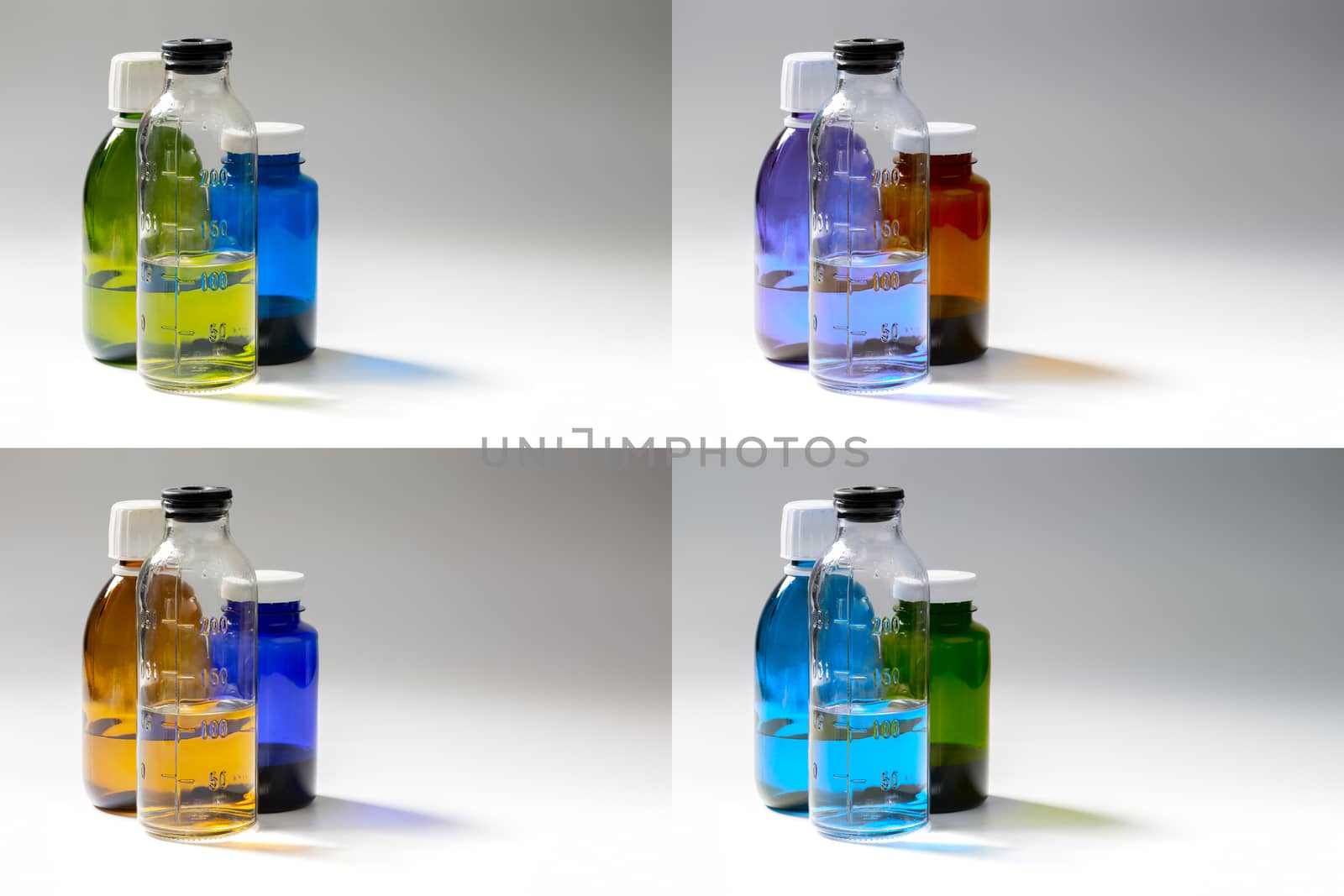 set of colored medial bottles on gray background with copyspace.