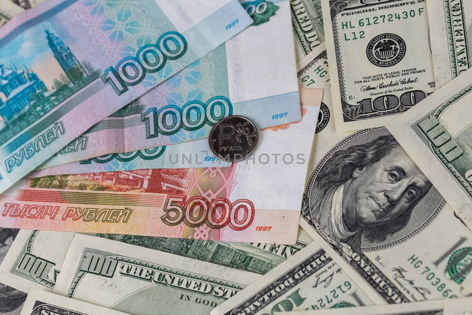 us dollars and russian rubles close-up background with selective focus.
