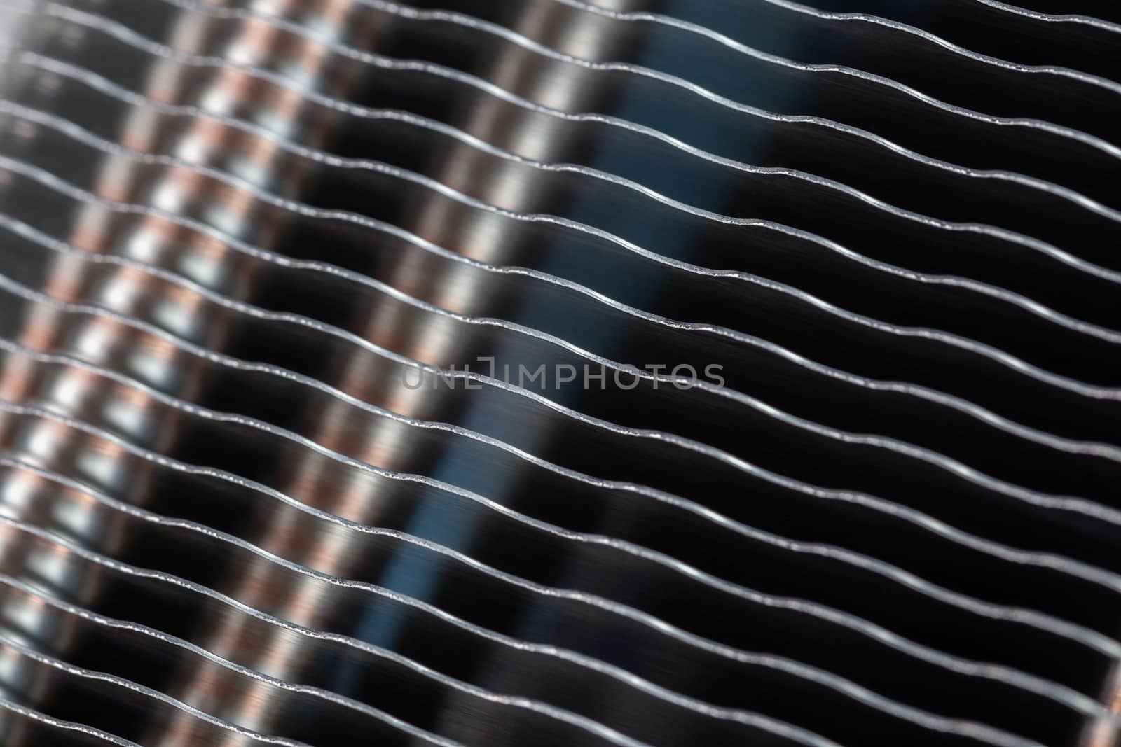 modern tower heat radiator closeup macro background with selective focus, blur and diagonal composition