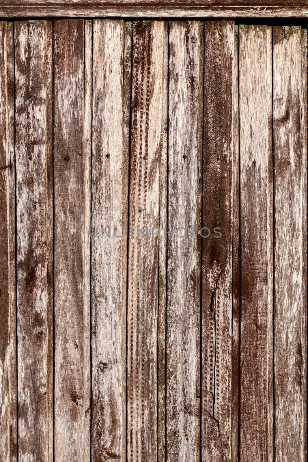 Weathered pink painted metal wall. Abstract background and rough texture.