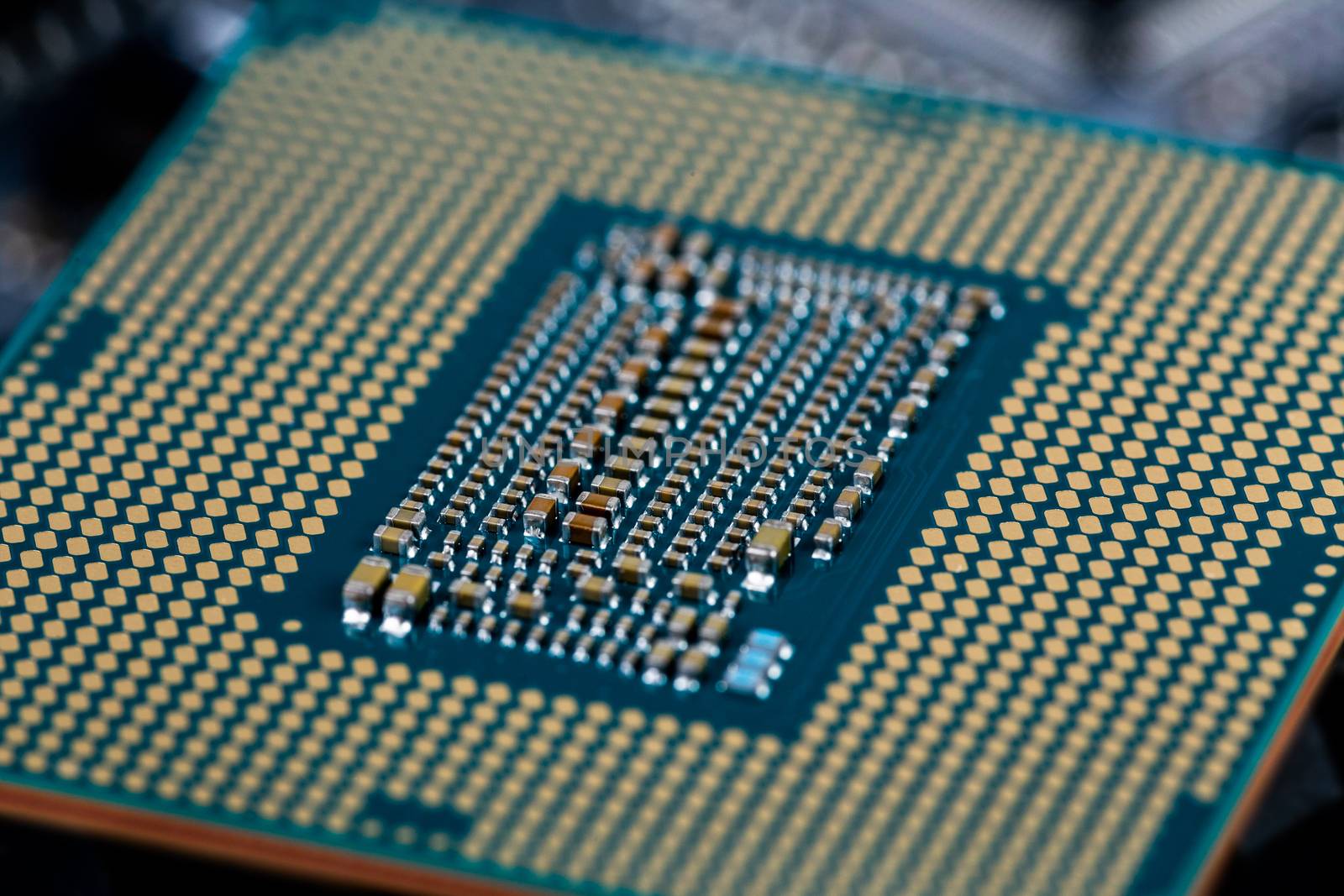 back side of modern lga 1151v2 central processor unit - closeup with selective fcus and blur.