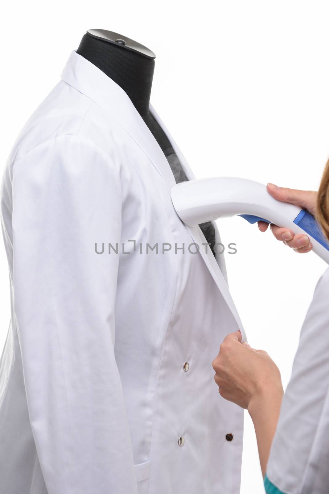 steaming medical clothing on a manicure on a white background