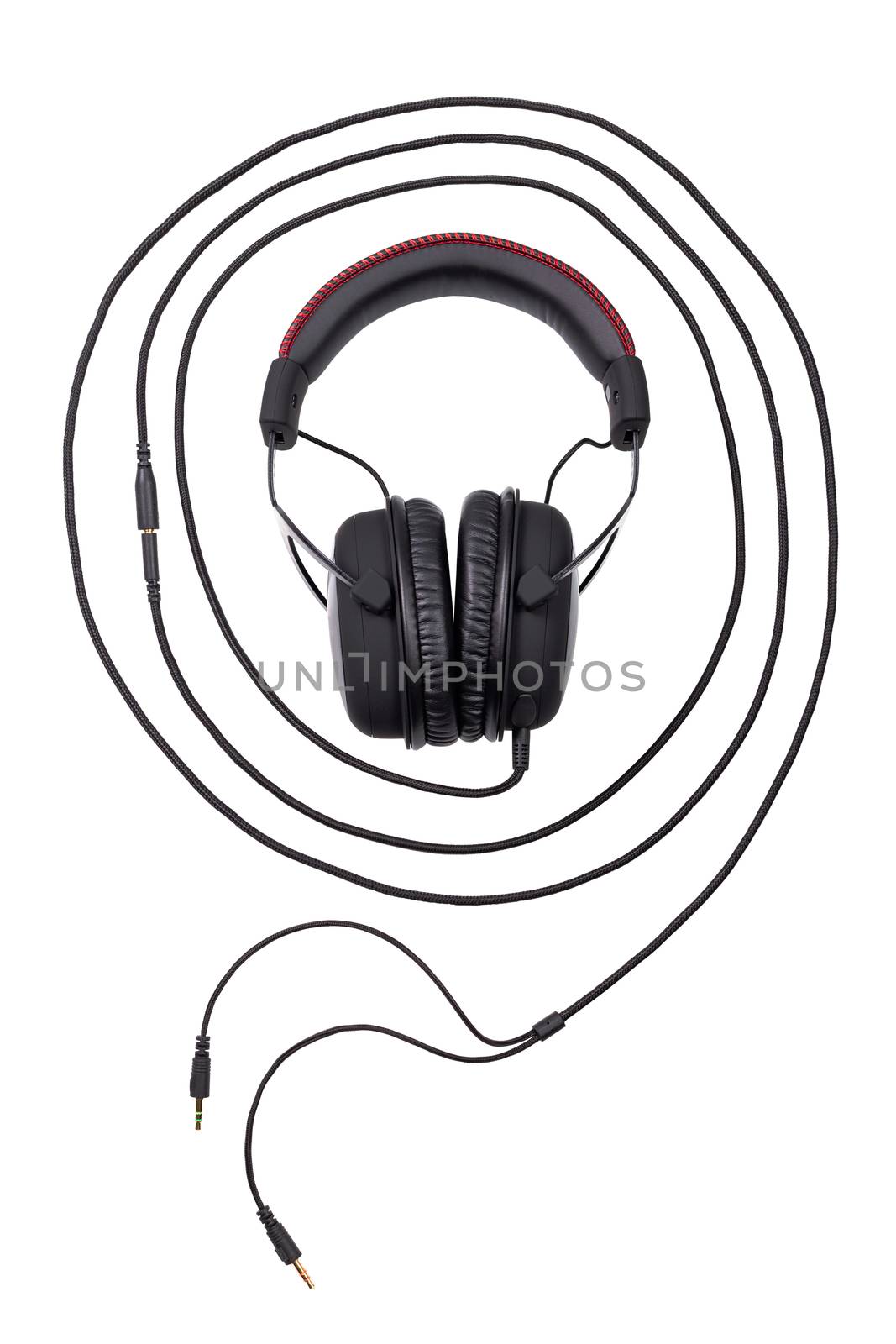 wired black gaming headset surrounded by it's wire's concentric circle - sound wave concept - isolated on white background in flat lay composition